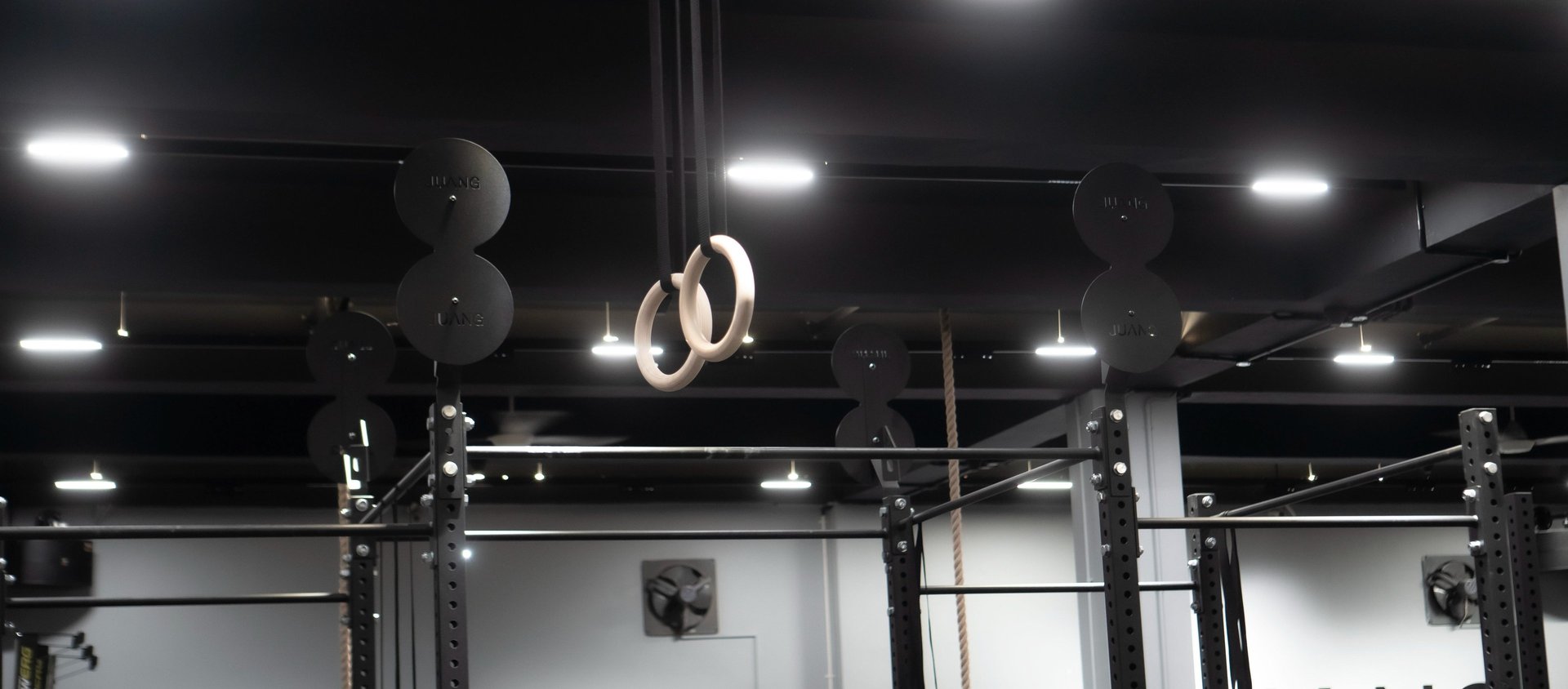 people in a room with a black table and chairs