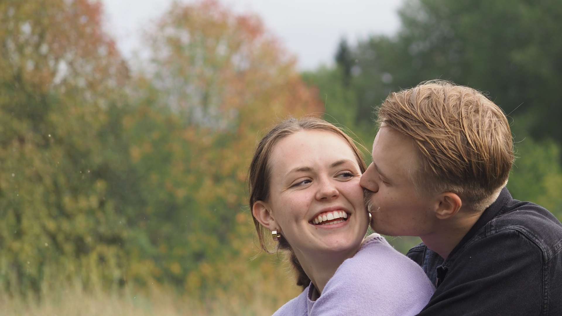 a close up of a bed with white sheets
