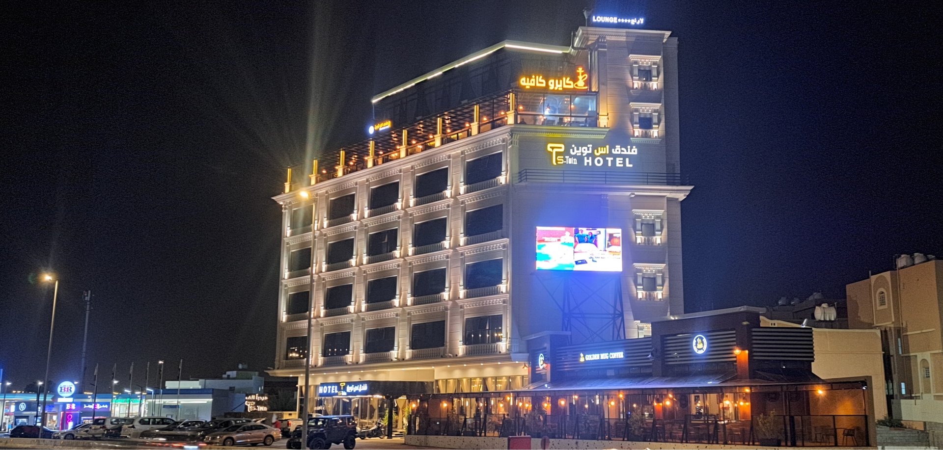an abstract photo of a curved building with a blue sky in the background