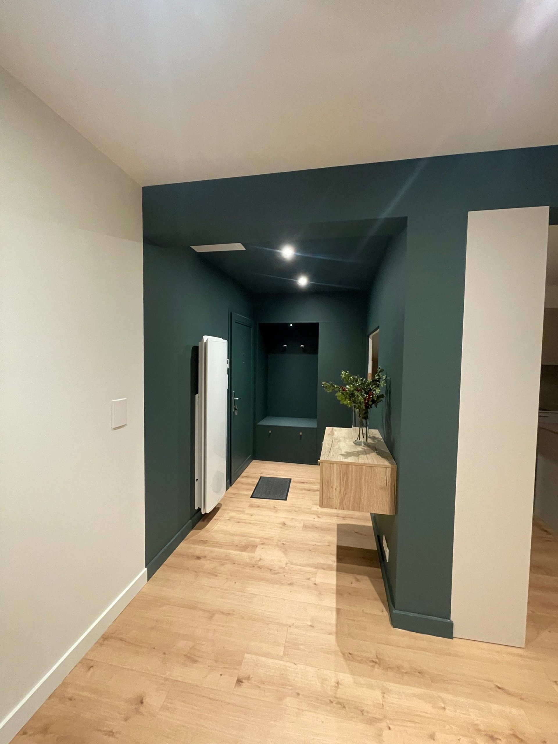 assorted-color paints and paintbrushes on white tarp