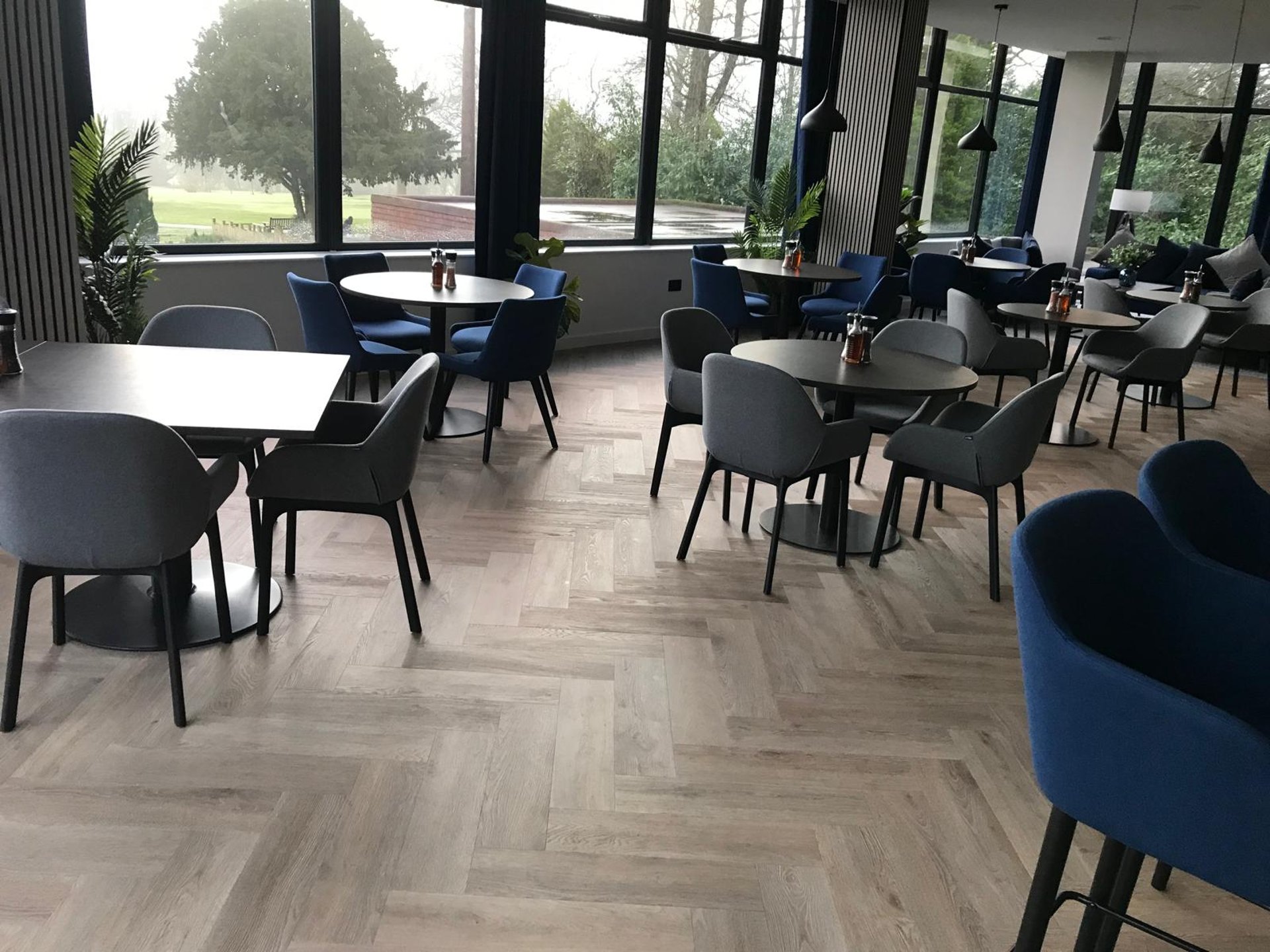 black and brown leather padded tub sofa