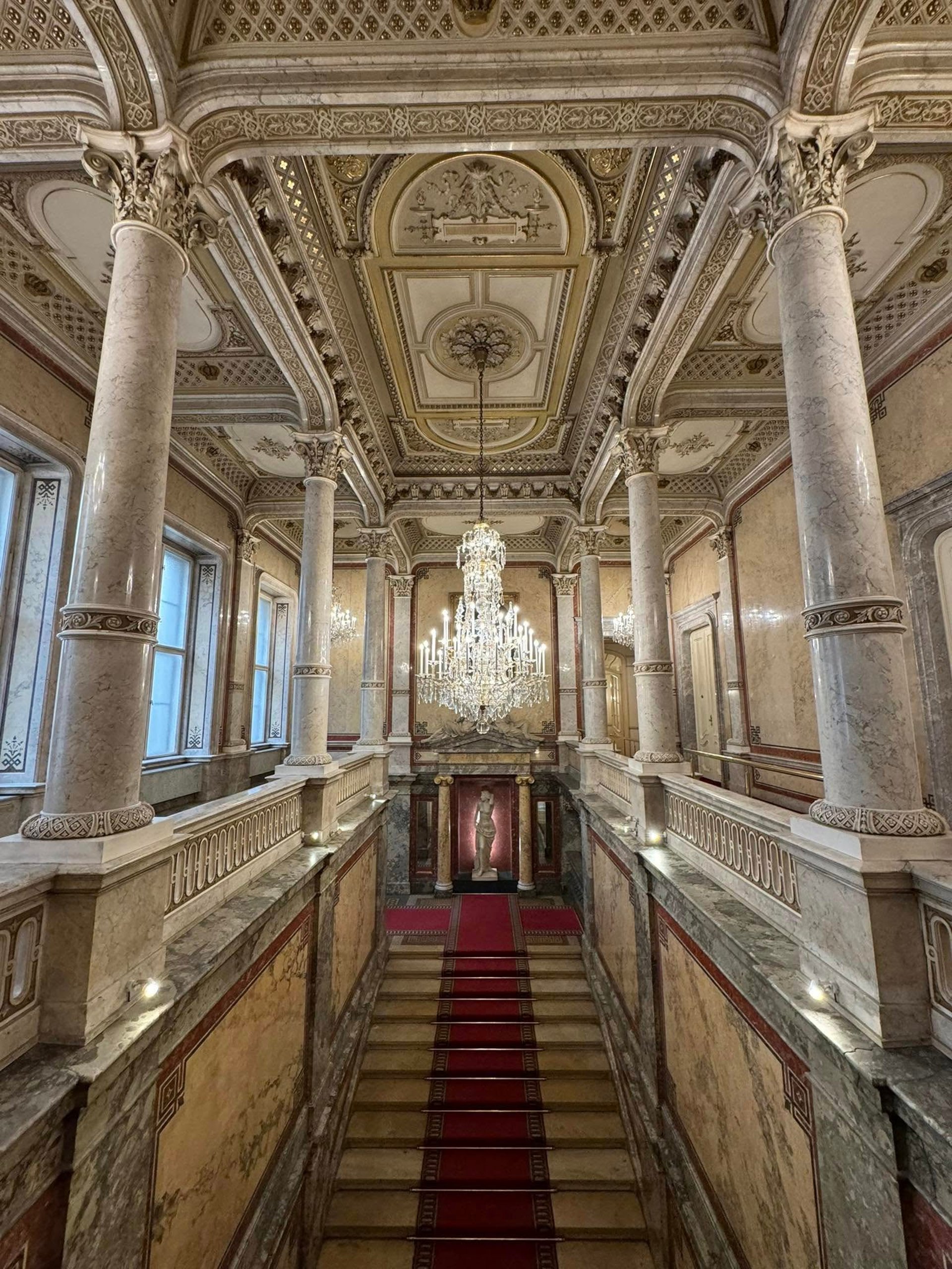 an abstract photo of a curved building with a blue sky in the background