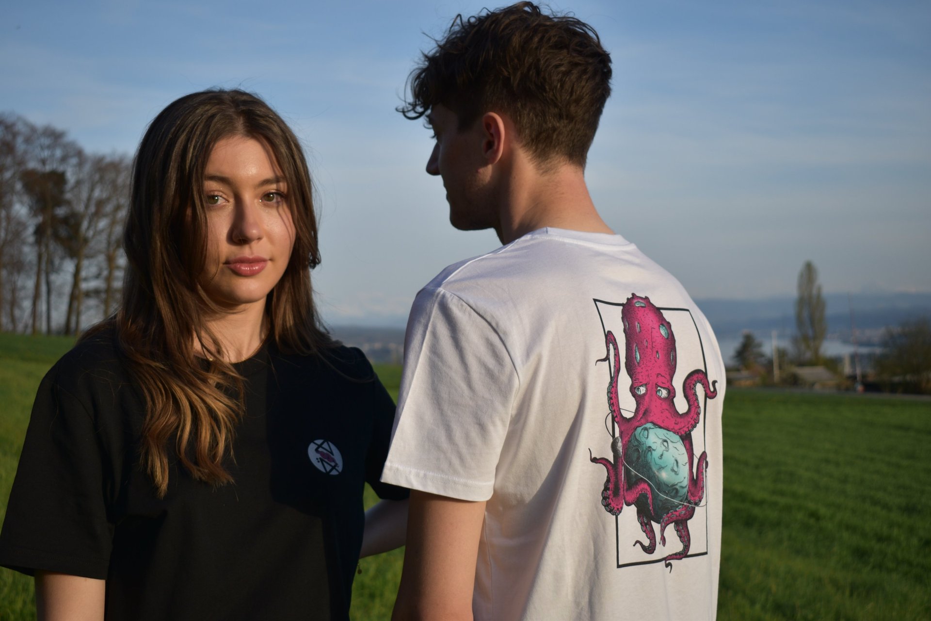 Male and female models wearing personalized t-shirts featuring a graphic octopus print
