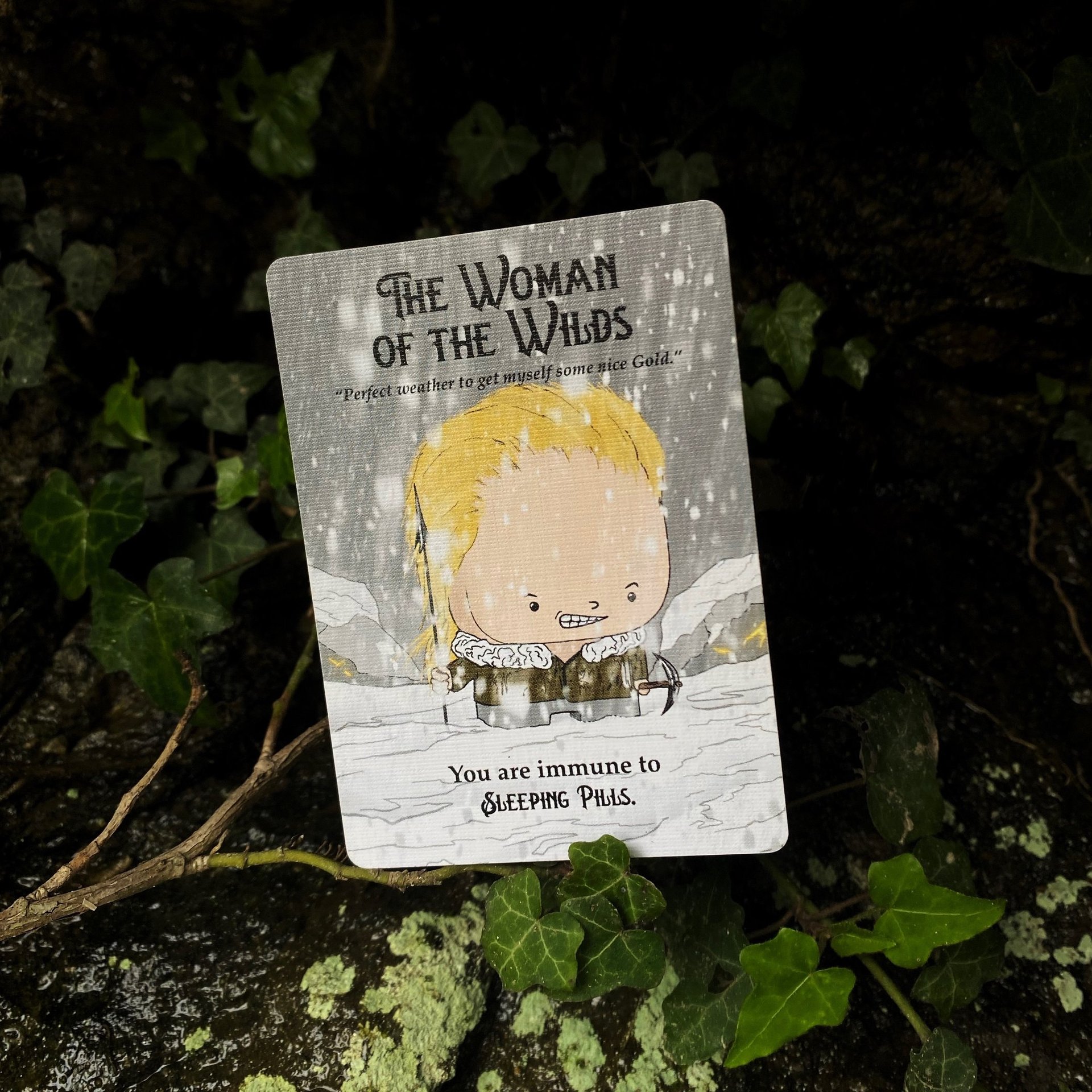 Game card the woman of the wilds from the card game eureka the mining card game, in the middle of the forest