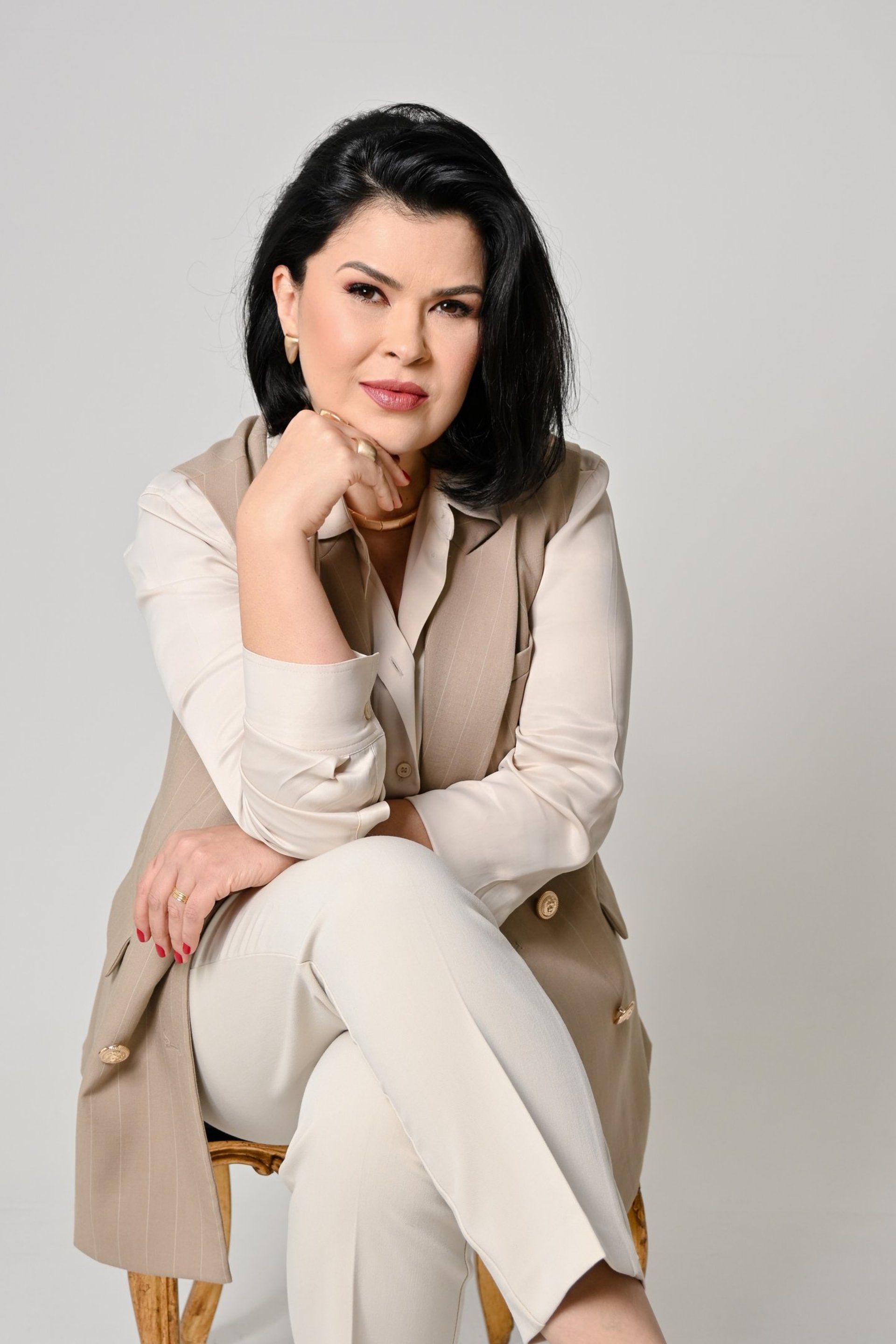 an abstract photo of a curved building with a blue sky in the background
