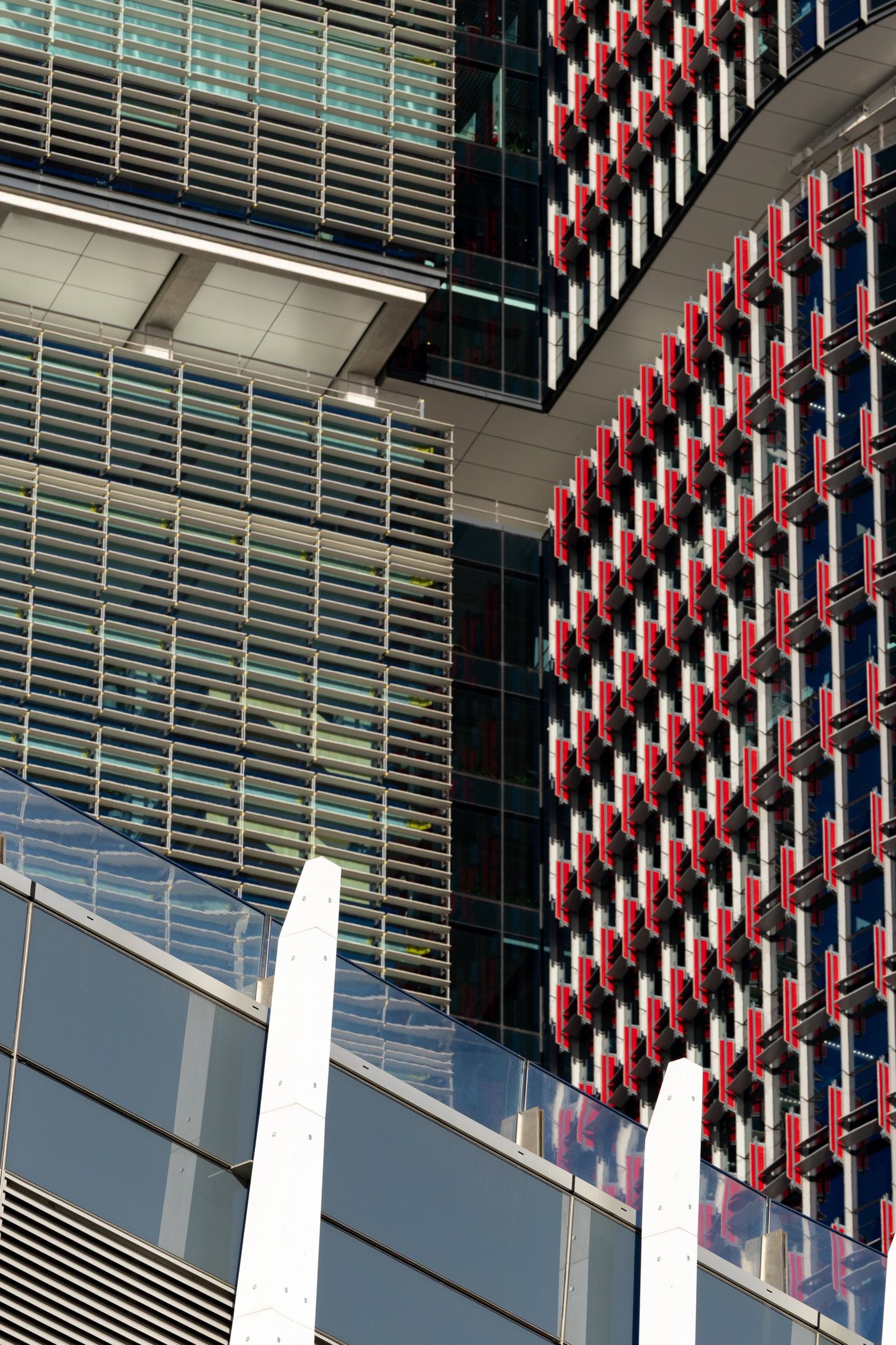 an abstract photo of a curved building with a blue sky in the background