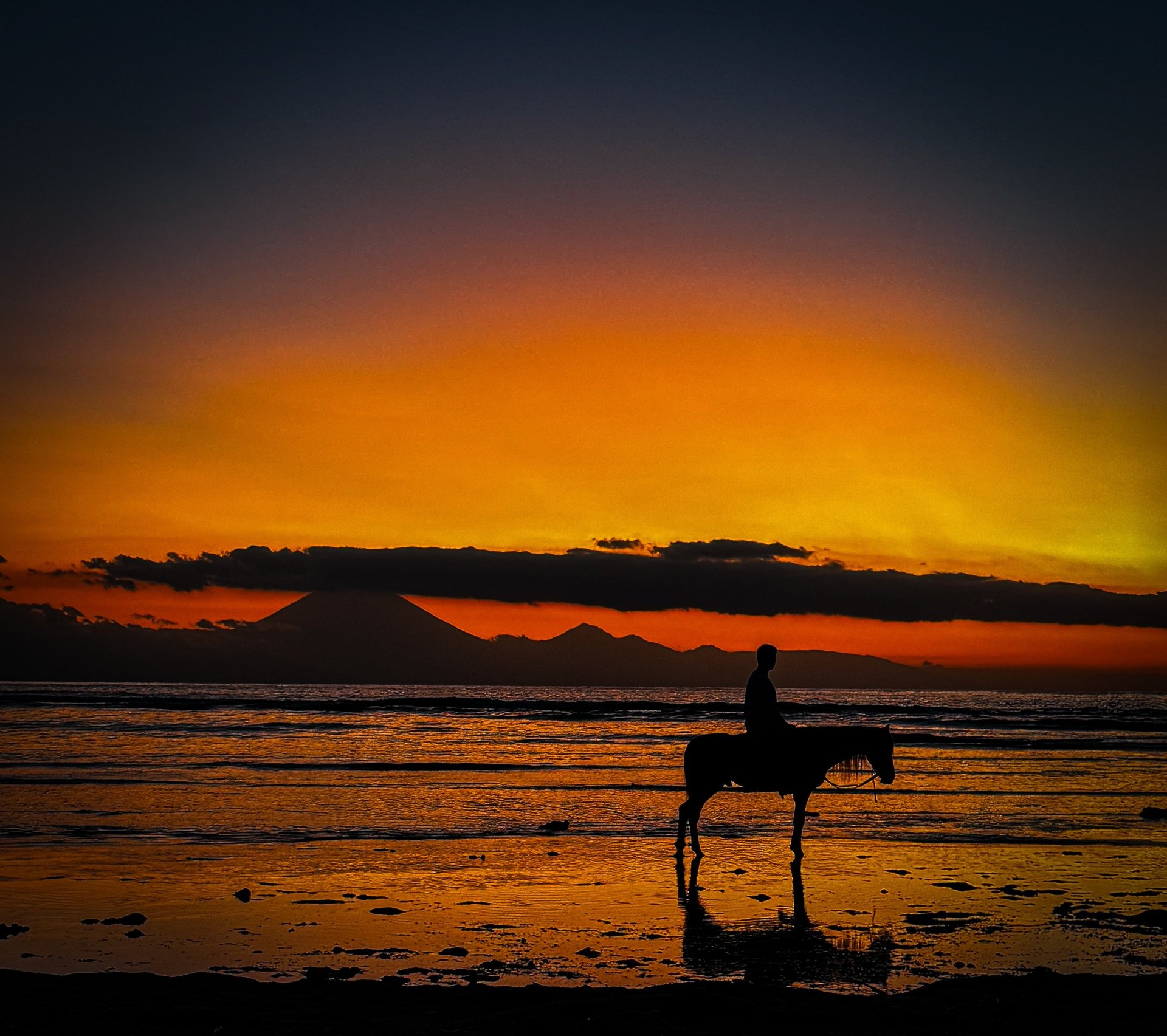 silhouette of girl and boy at the beach