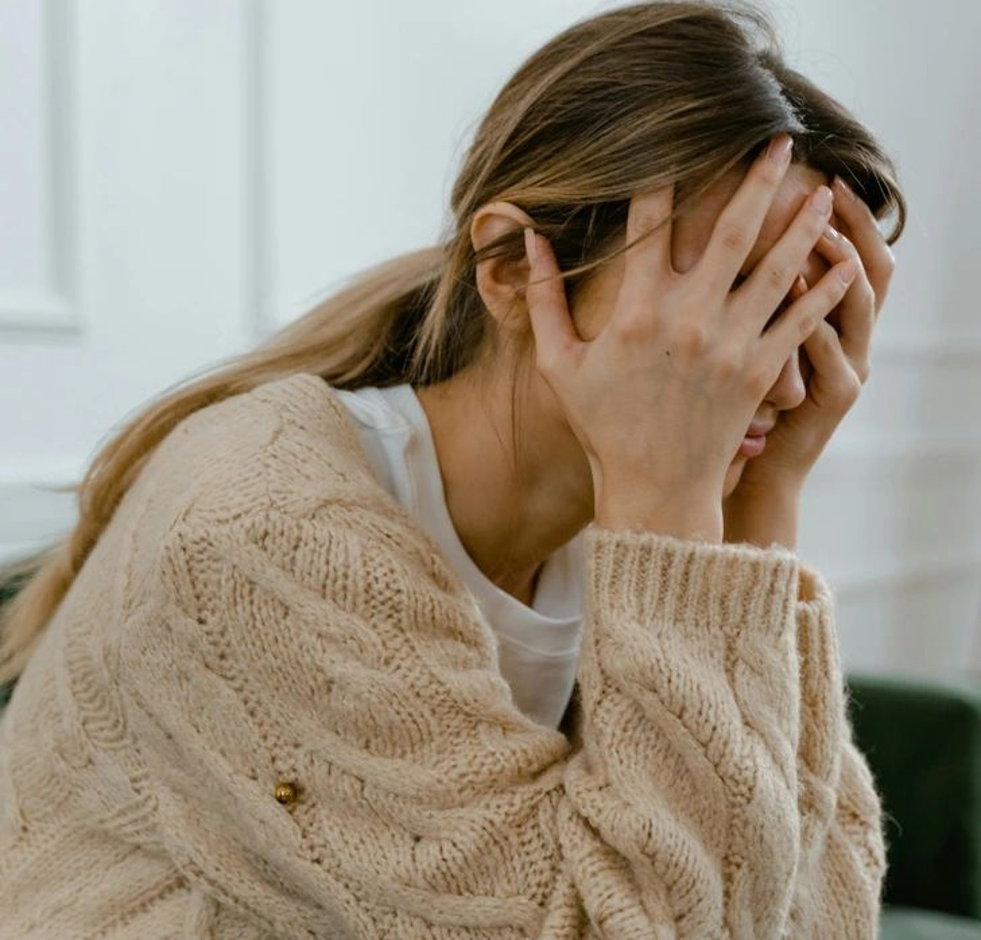 woman wearing yellow long-sleeved dress under white clouds and blue sky during daytime