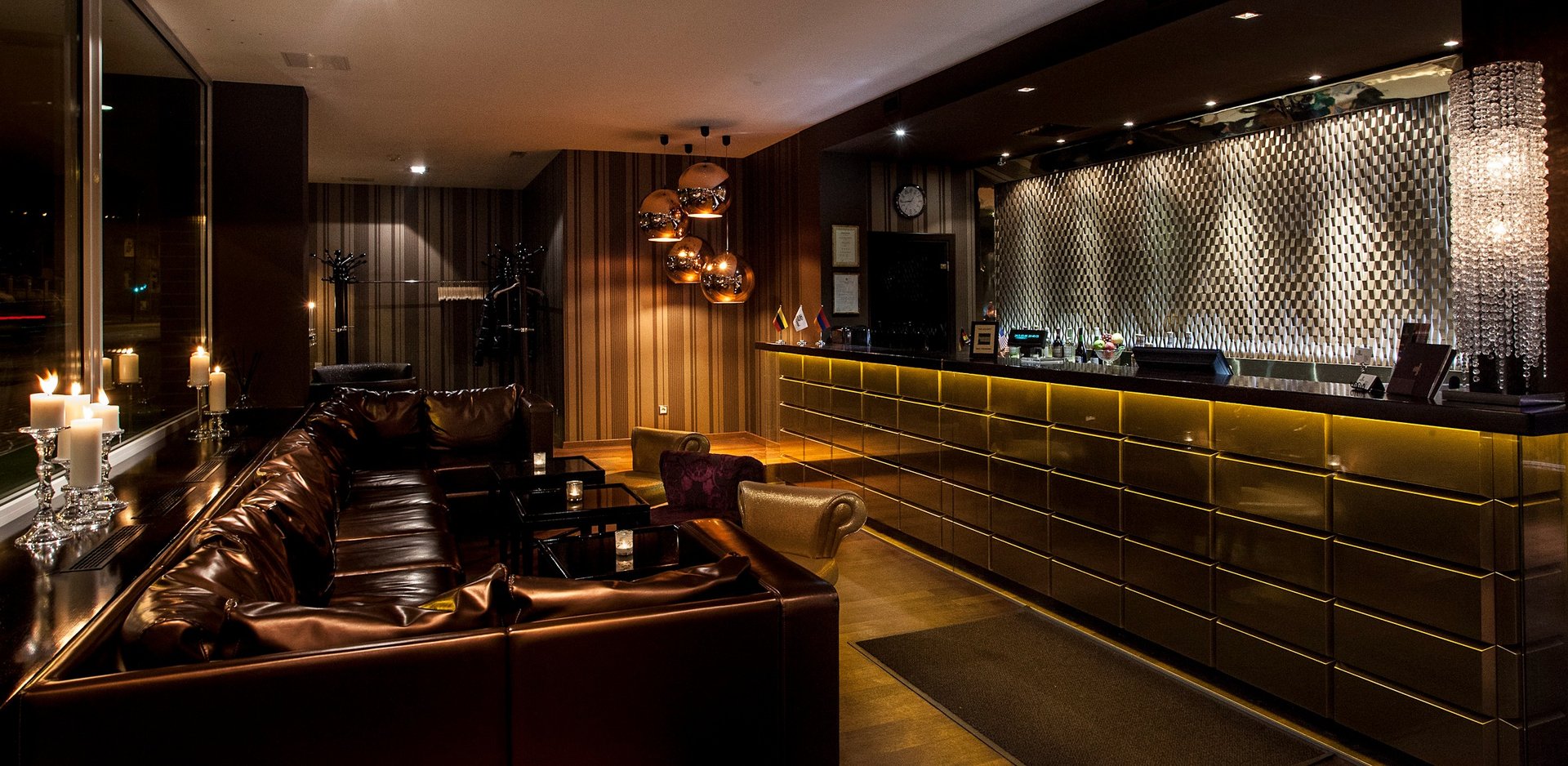 black and brown leather padded tub sofa