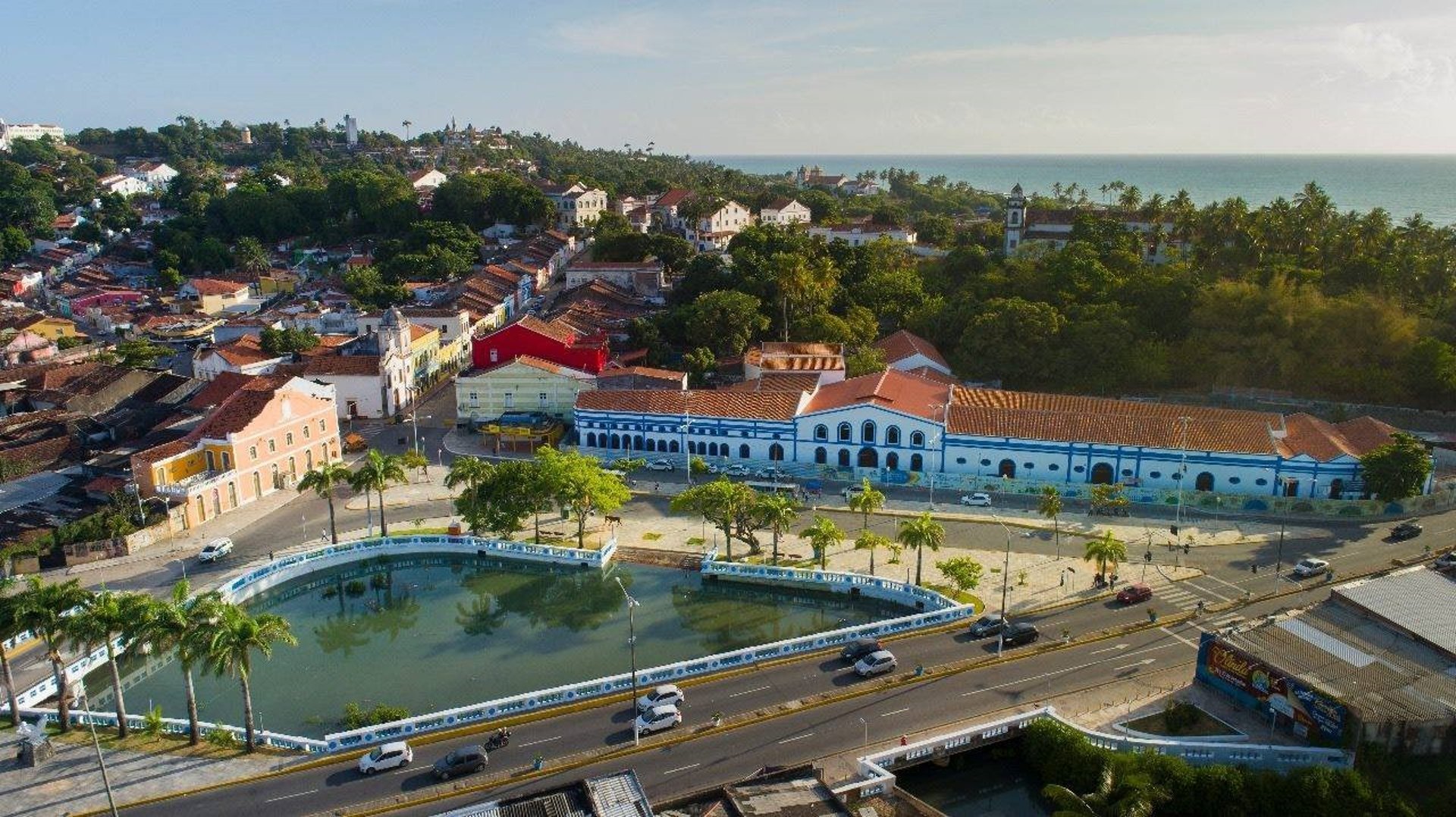 an abstract photo of a curved building with a blue sky in the background