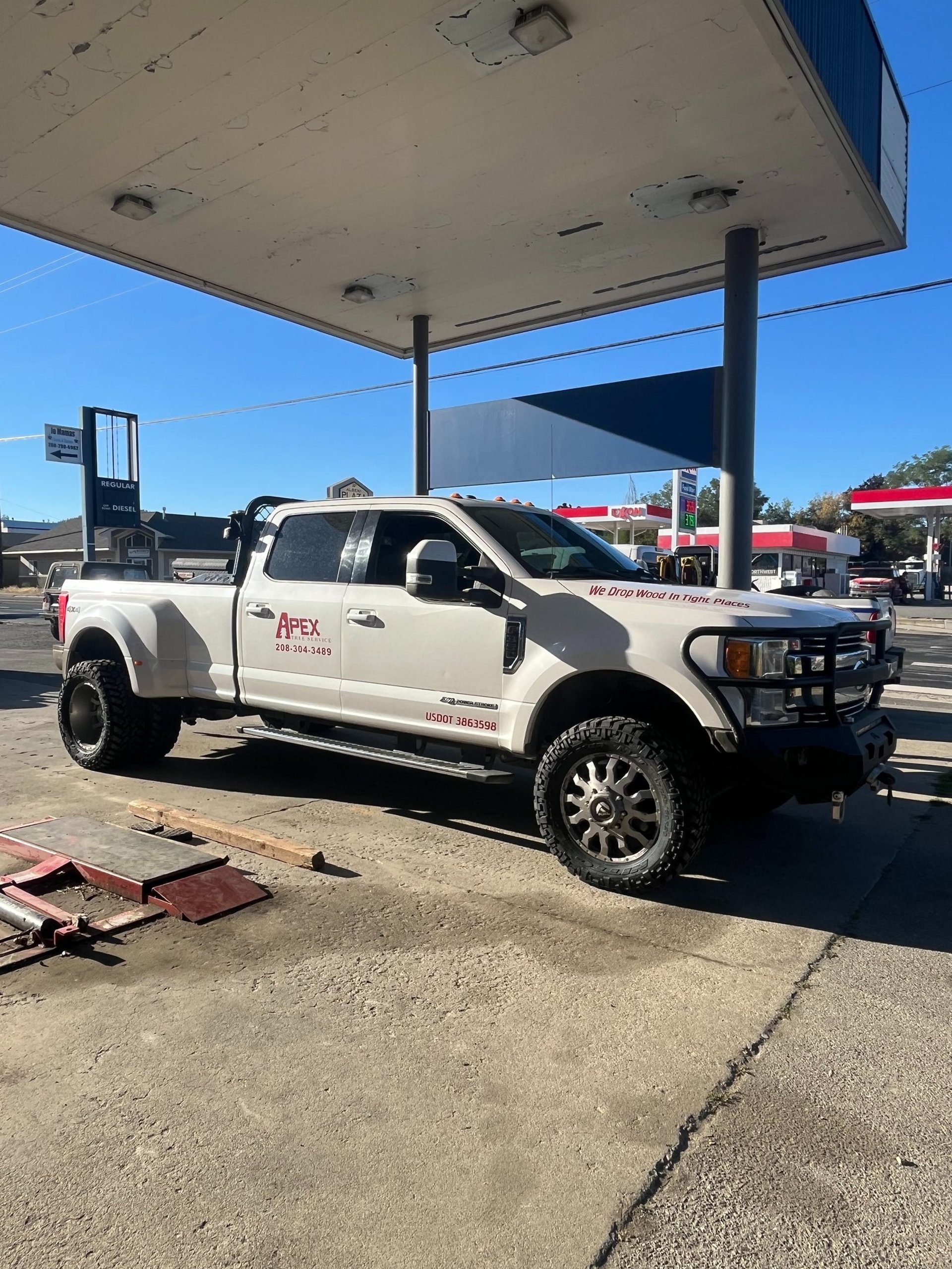 ford heavy duty with new offroad tires for a services business in sandpoint idaho