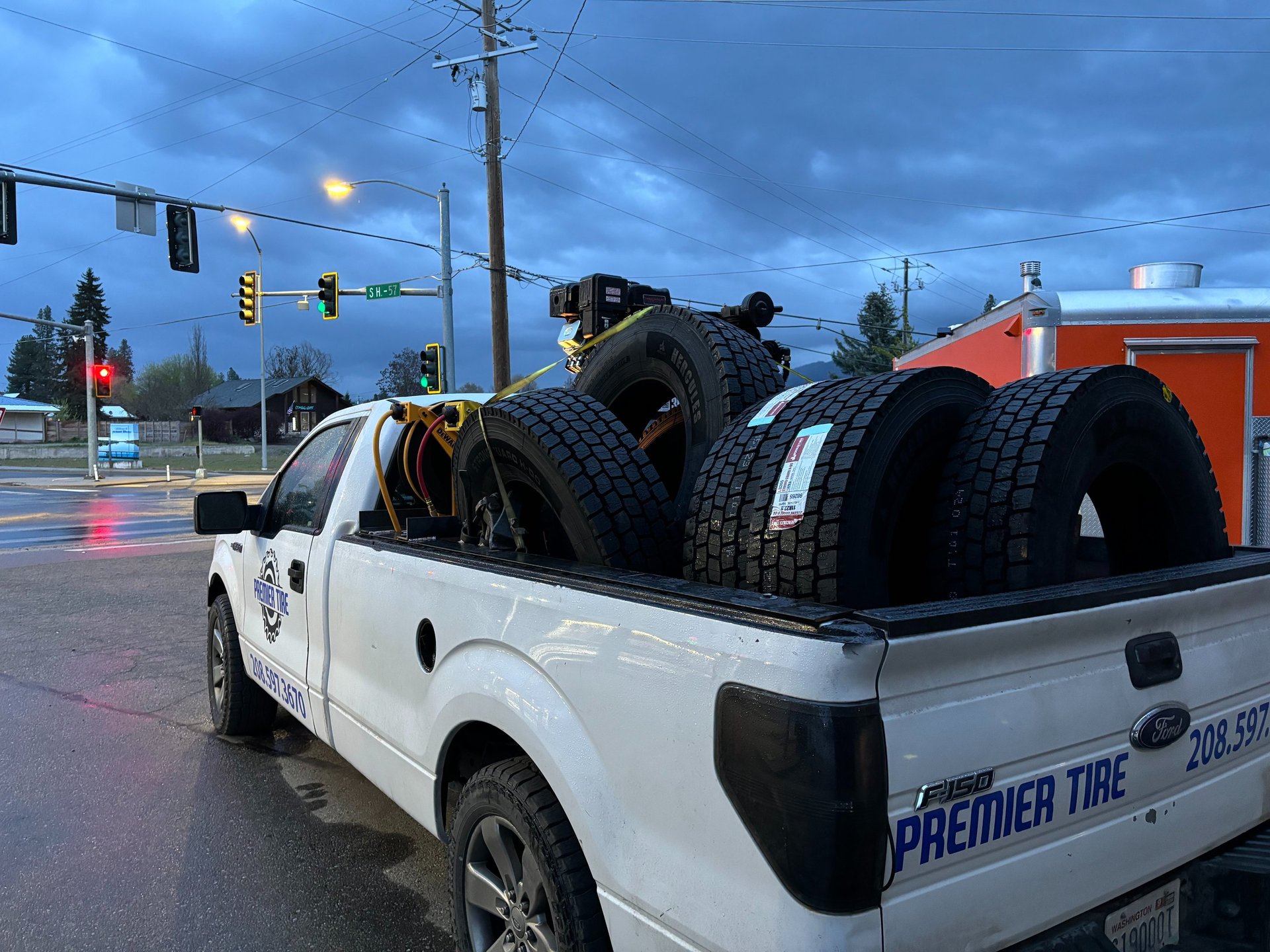 a white f-150 holds mobile repair service tires in sandpoint idaho