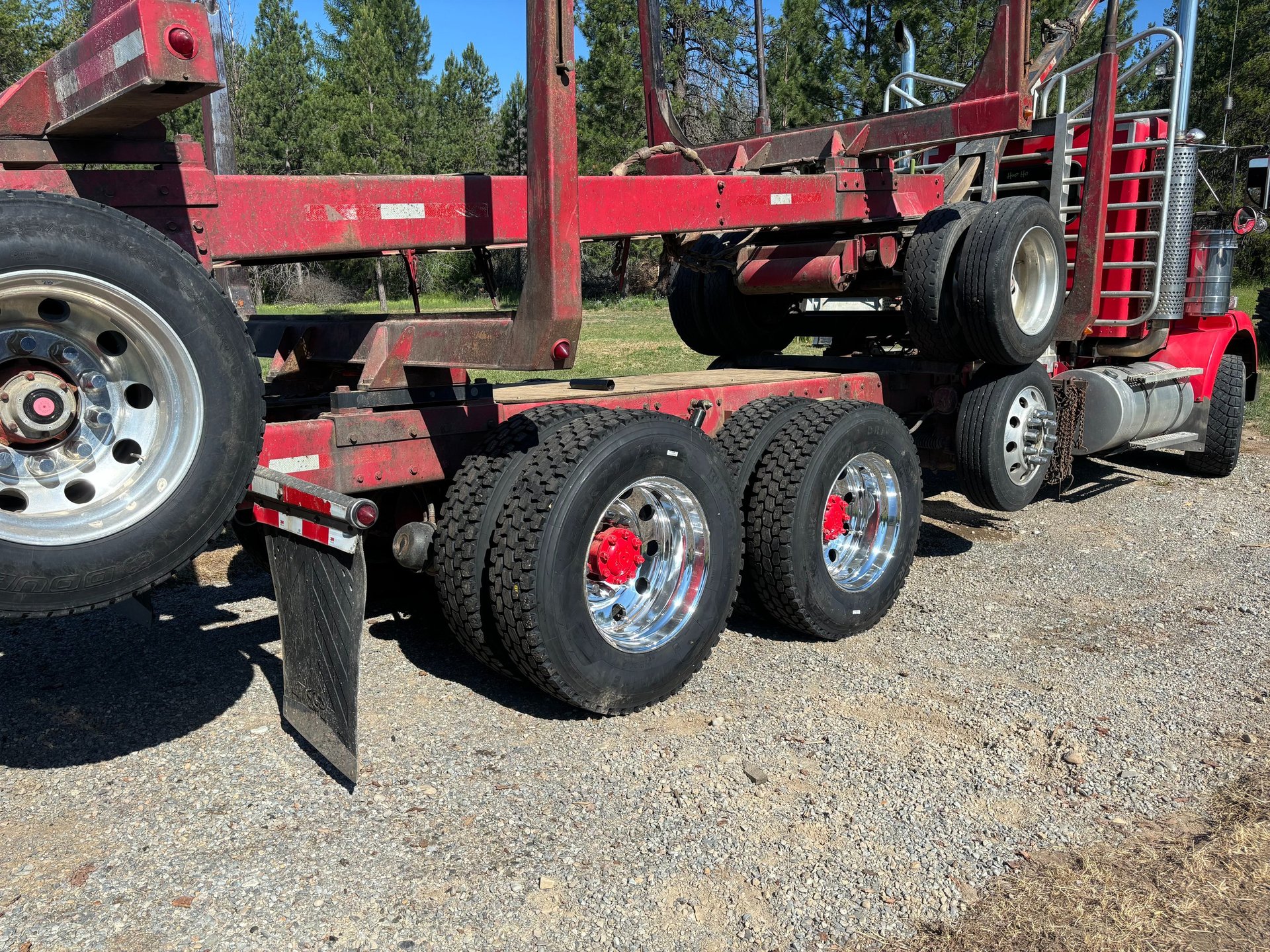 a heavy duty log truck with new tires and hub caps from premier tire in sandpoint idaho