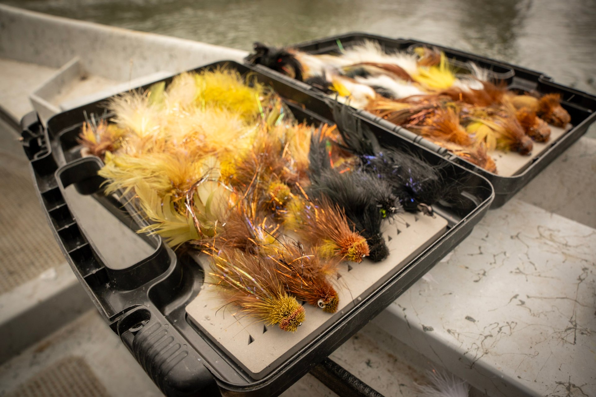 Head guide John Stunkard stands with Joe as they capture a new personal best brown trout.