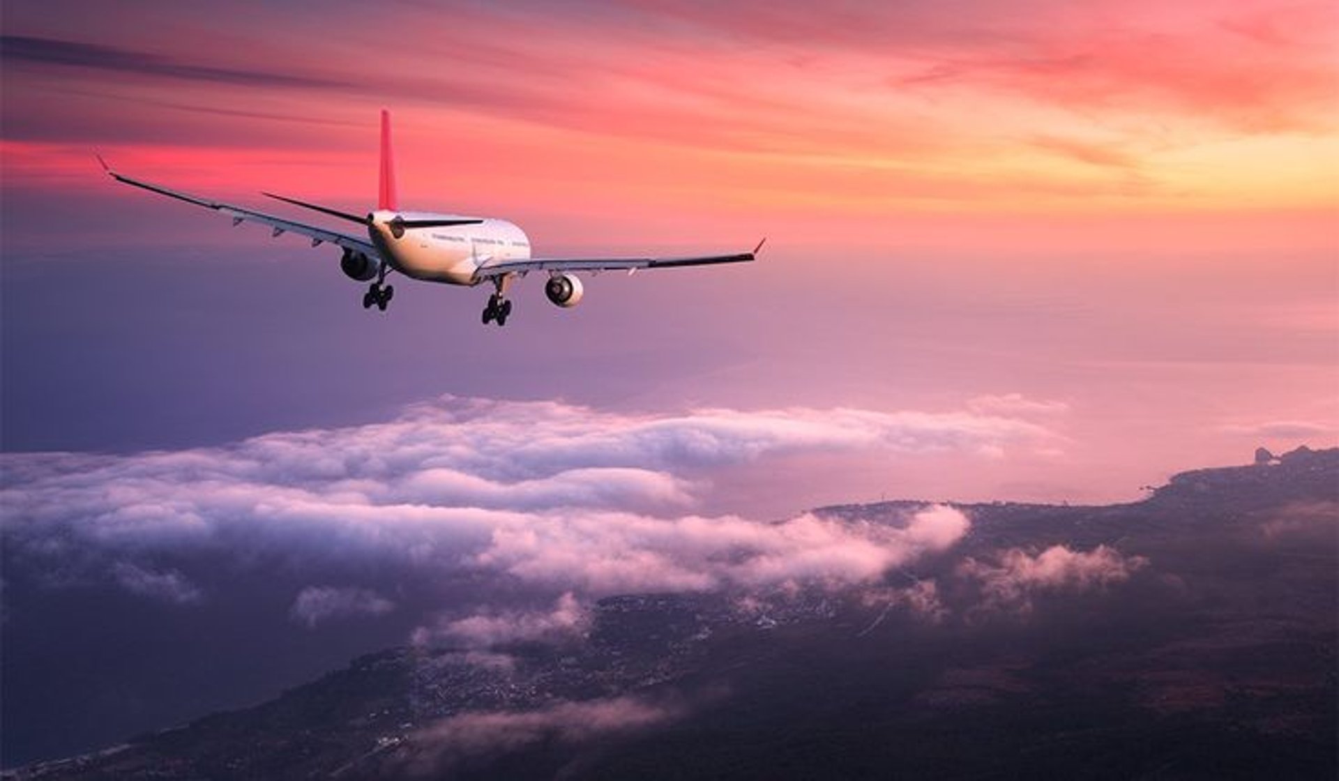woman wearing yellow long-sleeved dress under white clouds and blue sky during daytime