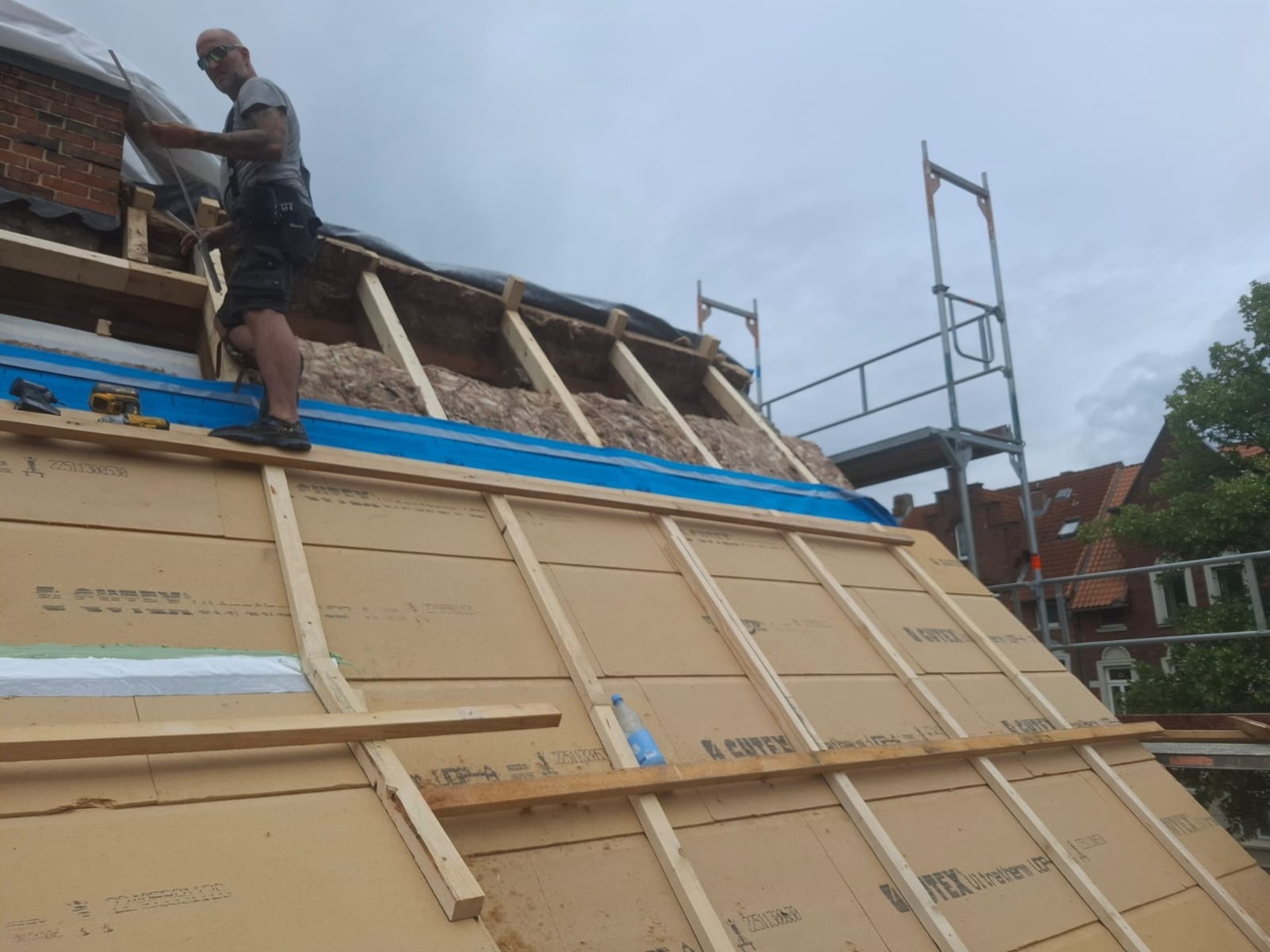 a man riding a skateboard on top of a roof