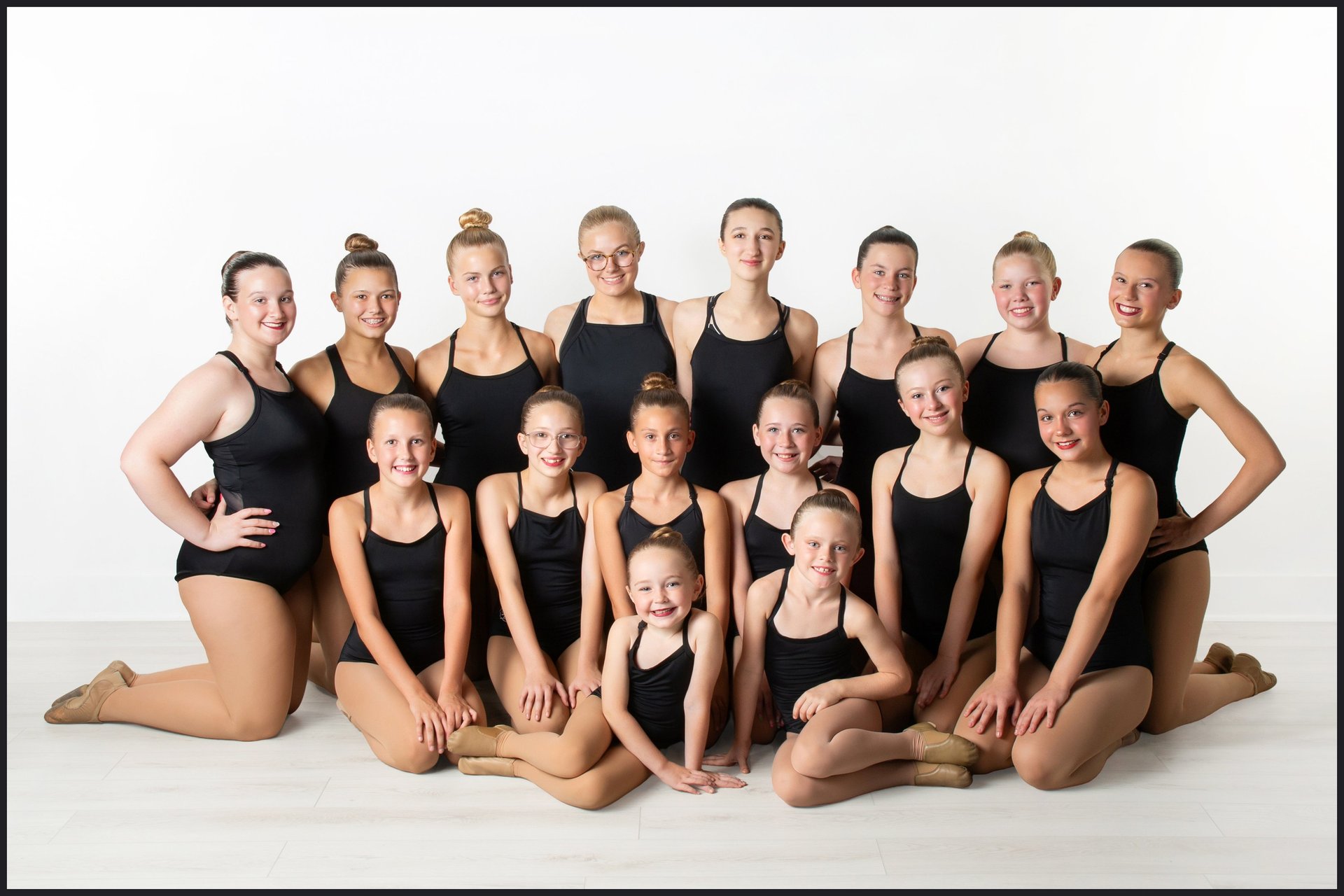 black and brown leather padded tub sofa