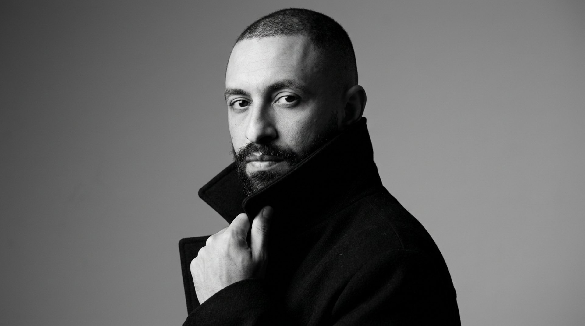 an abstract photo of a curved building with a blue sky in the background