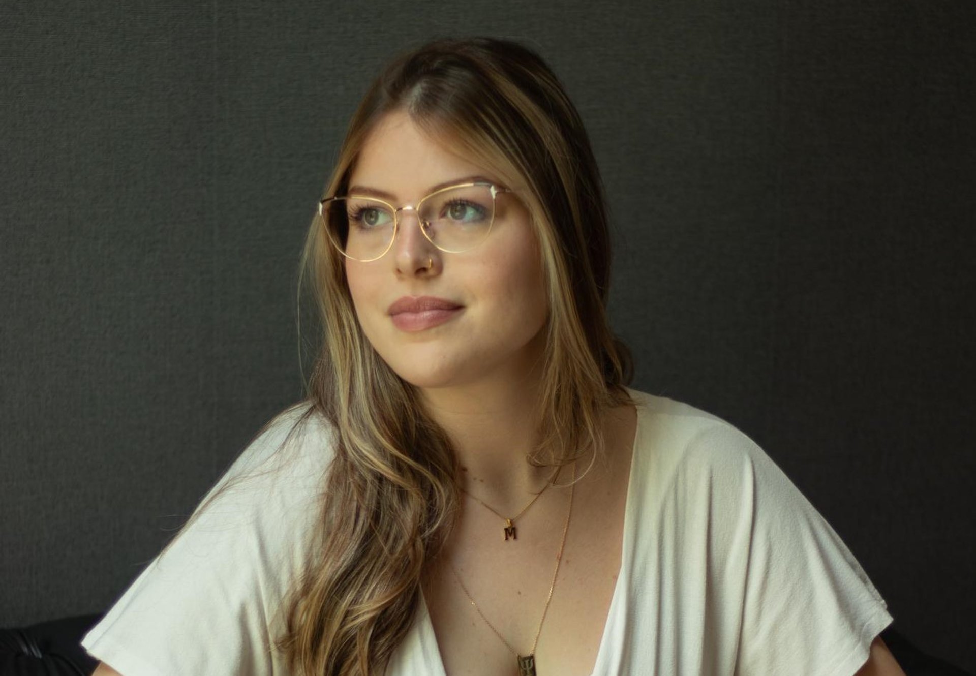 an abstract photo of a curved building with a blue sky in the background
