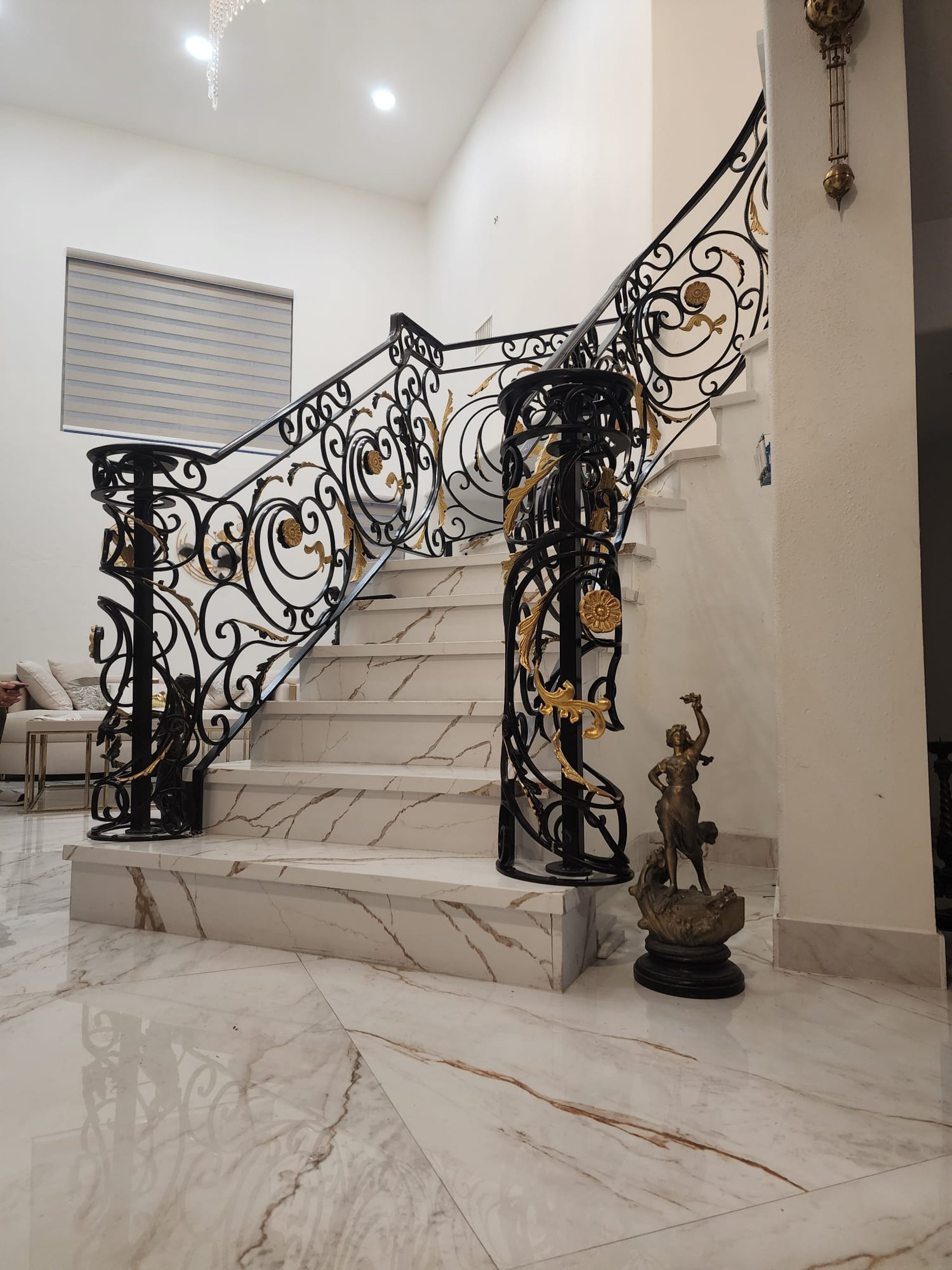 white metal staircase on gray concrete floor