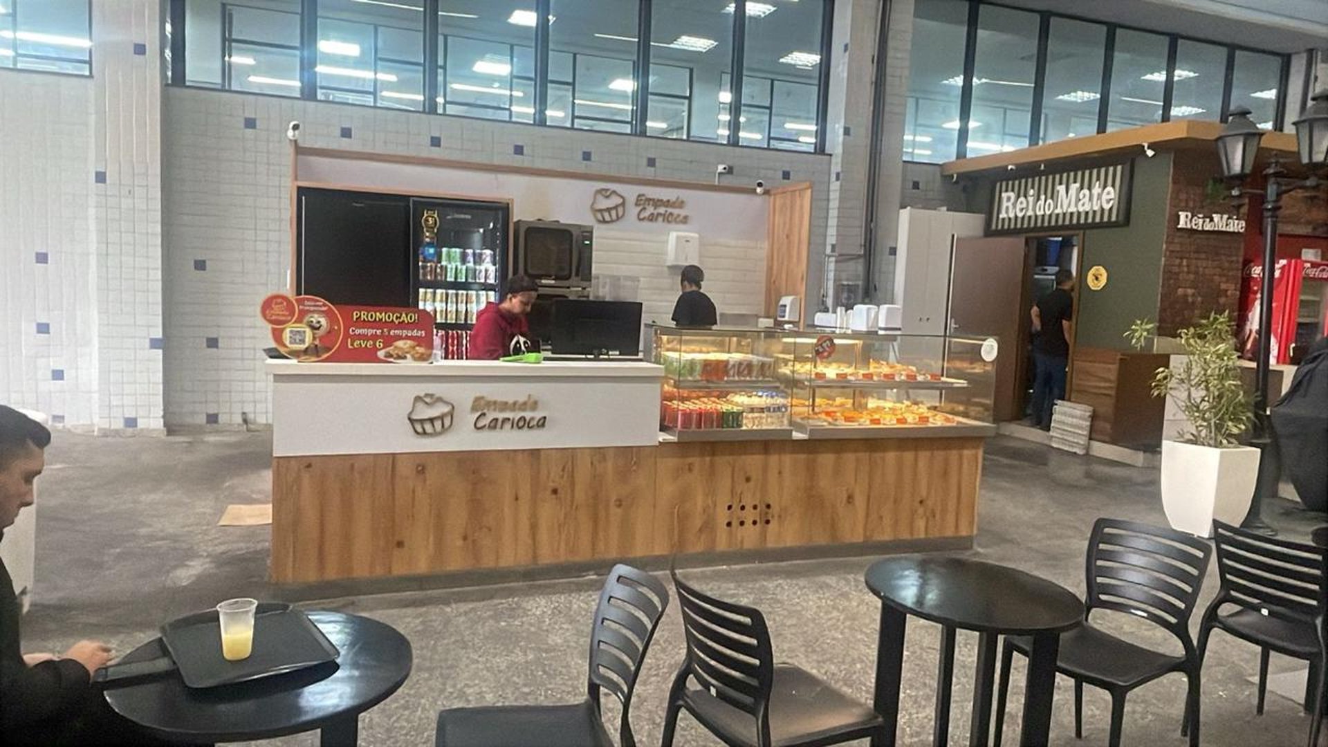 an abstract photo of a curved building with a blue sky in the background