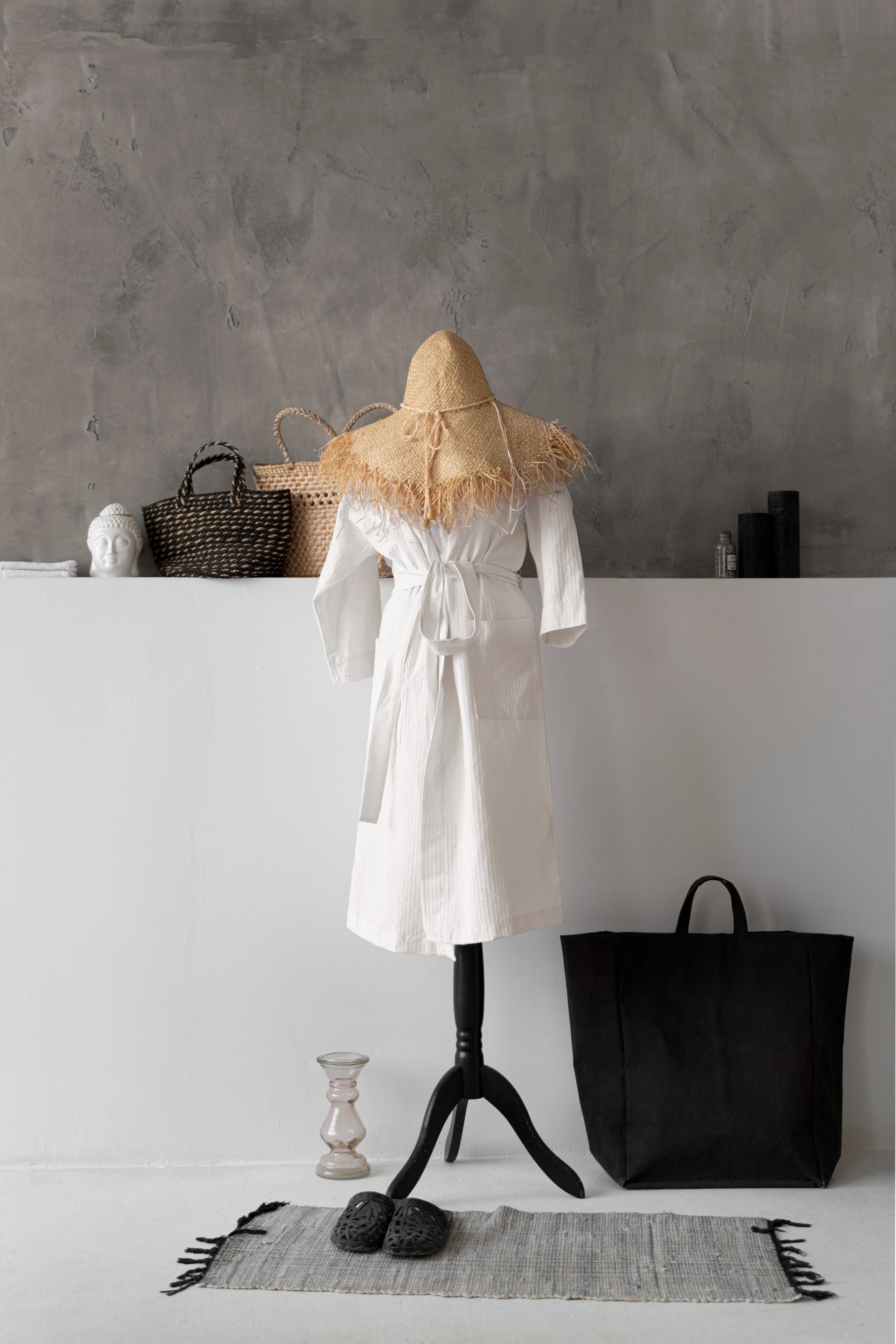 hanged top on brown and white clothes horse