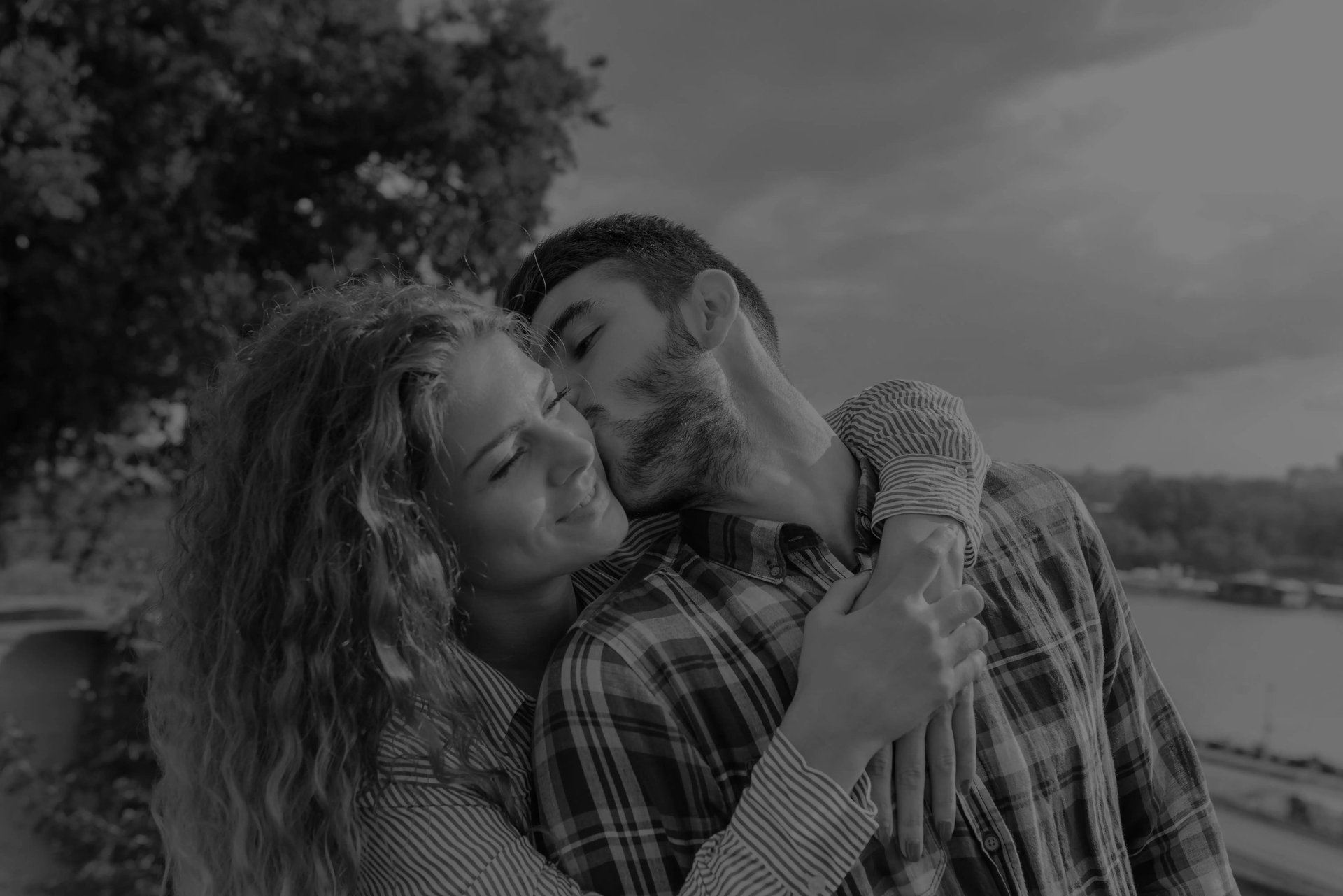 man in white crew neck shirt beside woman in blue shirt