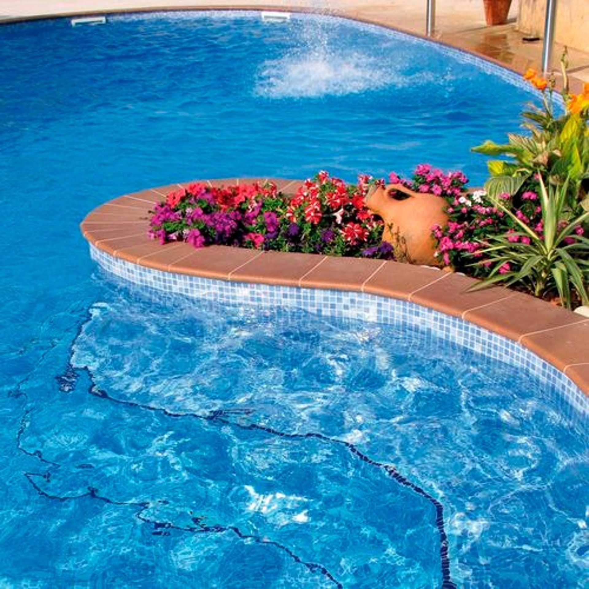 a very tall mountain with some clouds in the sky