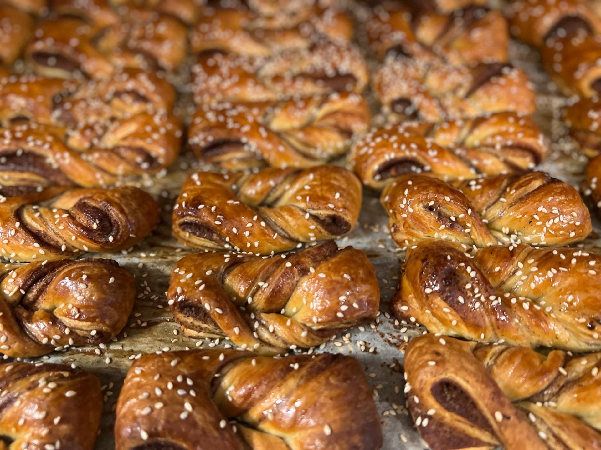 an abstract photo of a curved building with a blue sky in the background