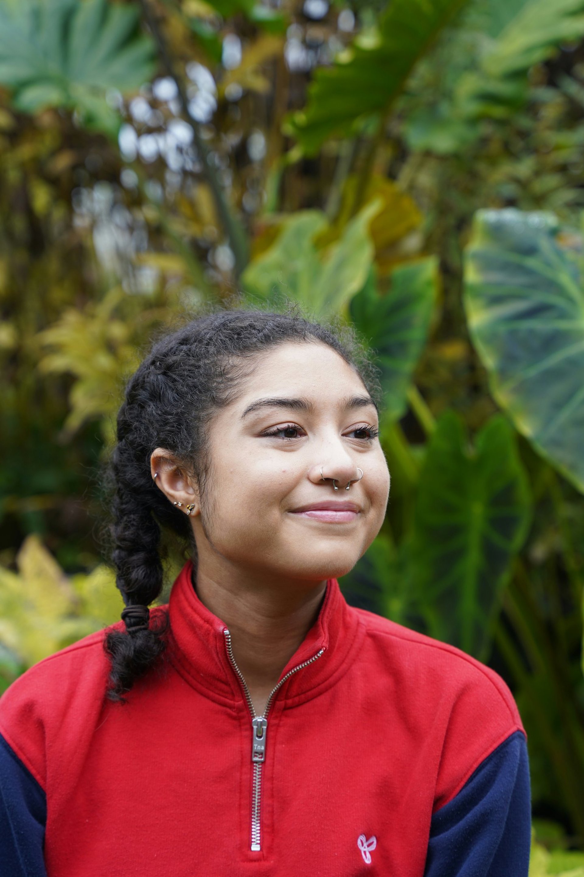 an abstract photo of a curved building with a blue sky in the background