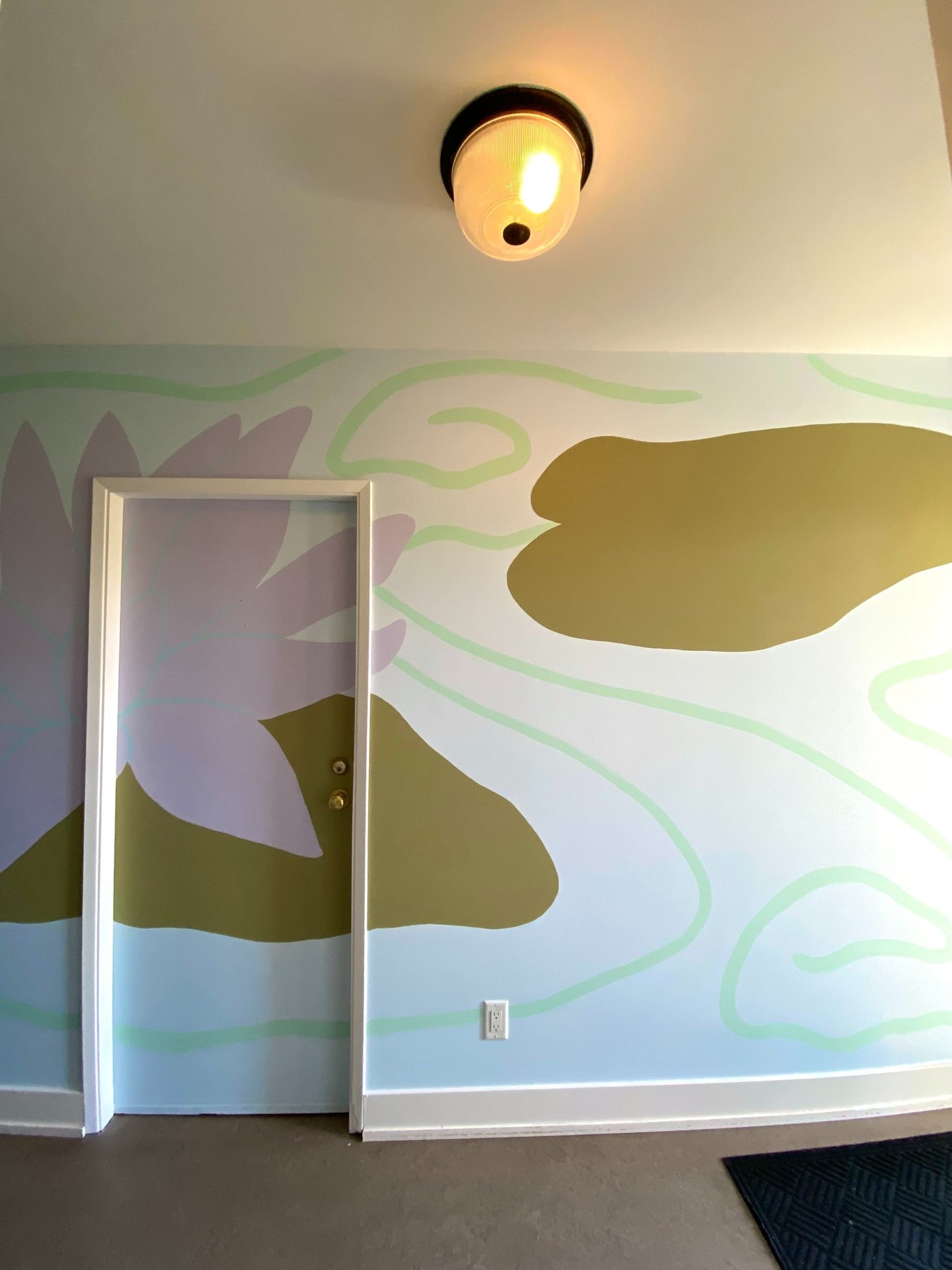Lotus flower, co-created mural on door of resident