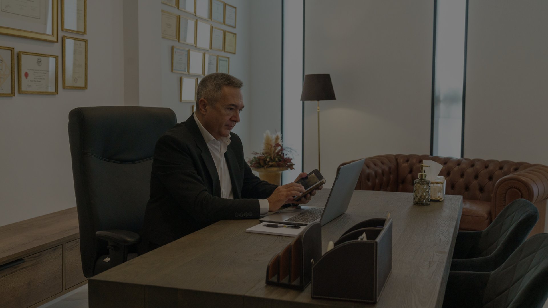 black and brown leather padded tub sofa