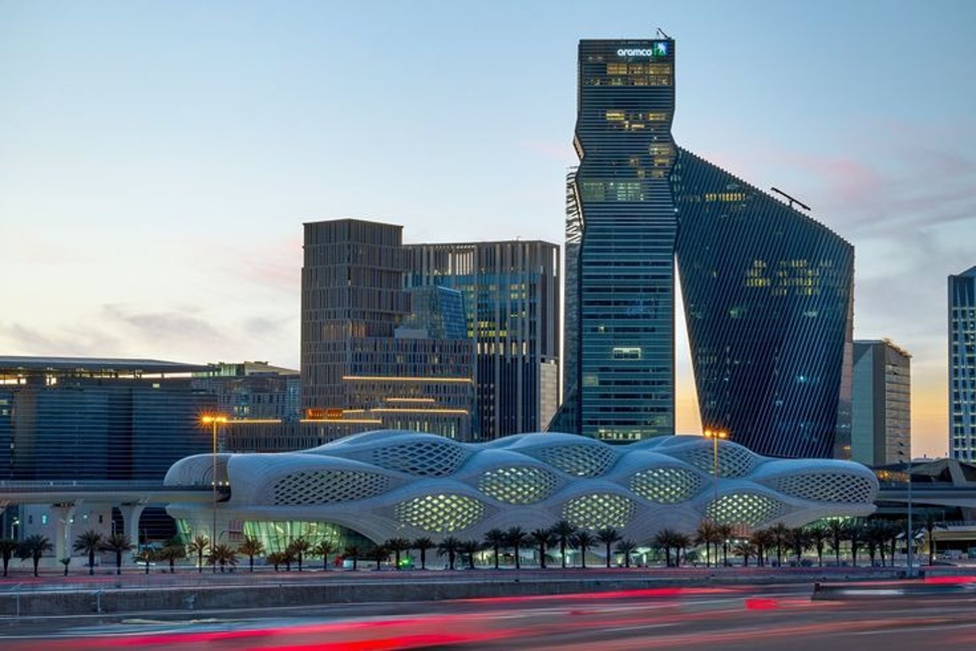 an abstract photo of a curved building with a blue sky in the background