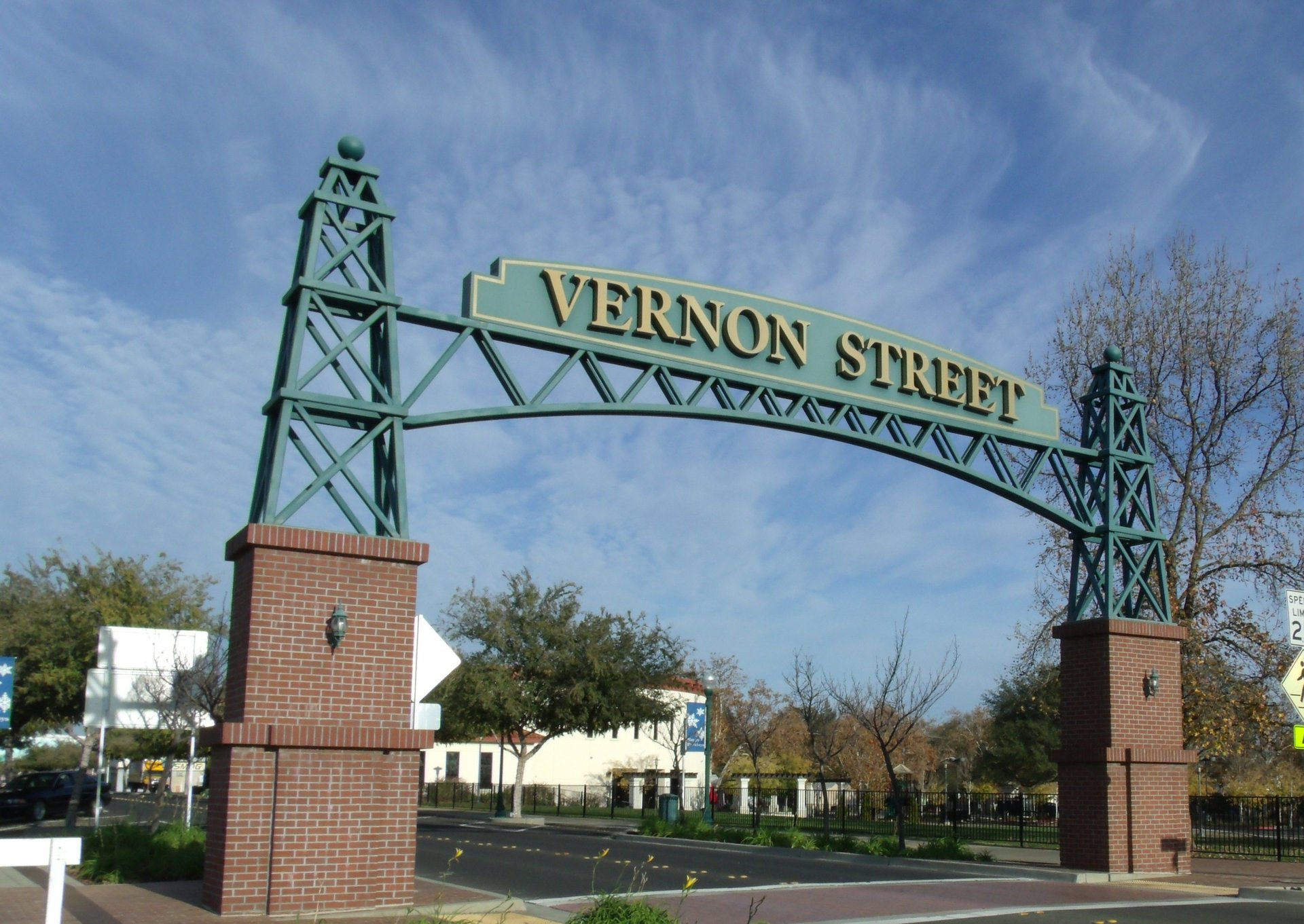 an abstract photo of a curved building with a blue sky in the background