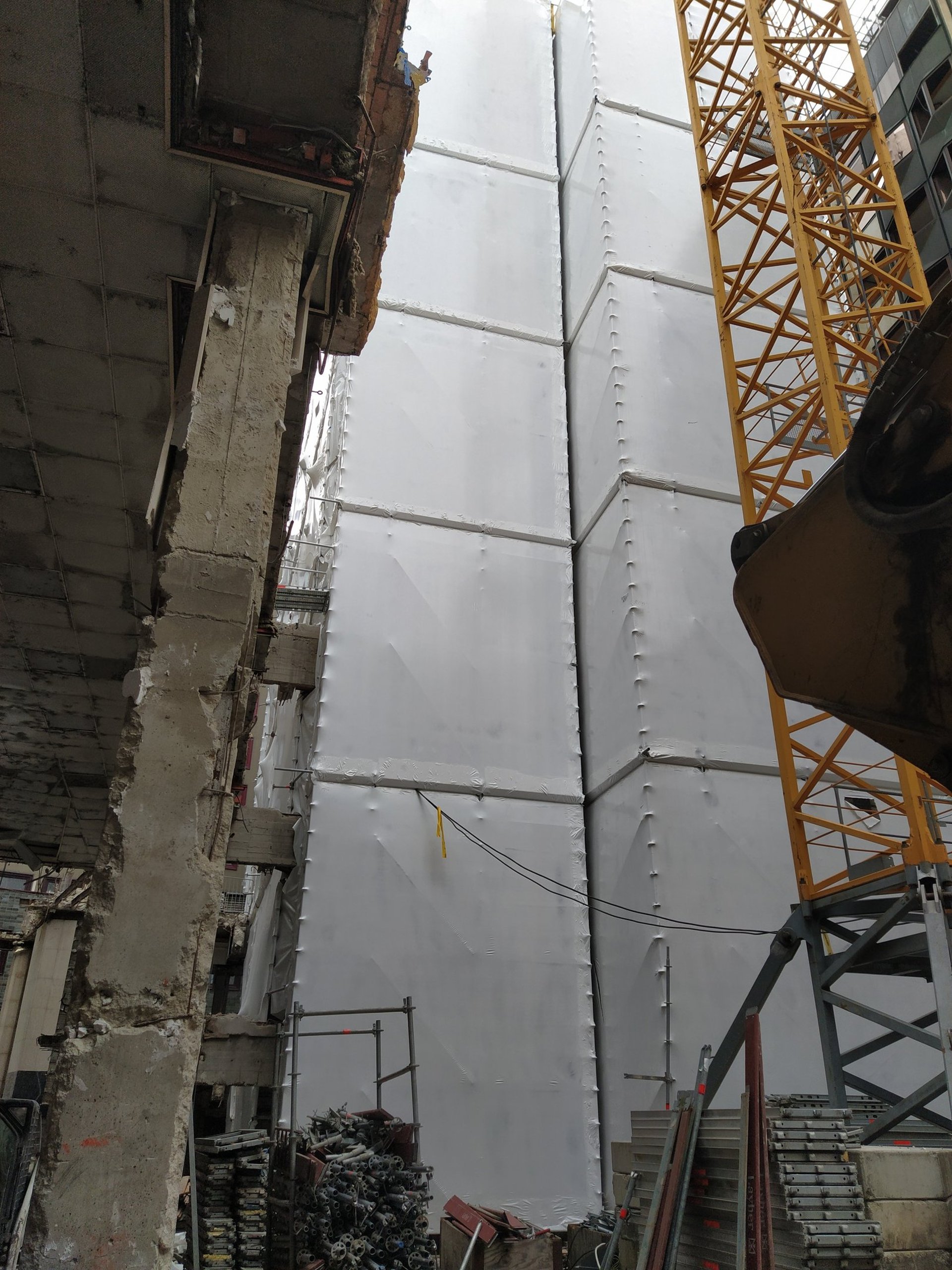 woman wearing yellow long-sleeved dress under white clouds and blue sky during daytime