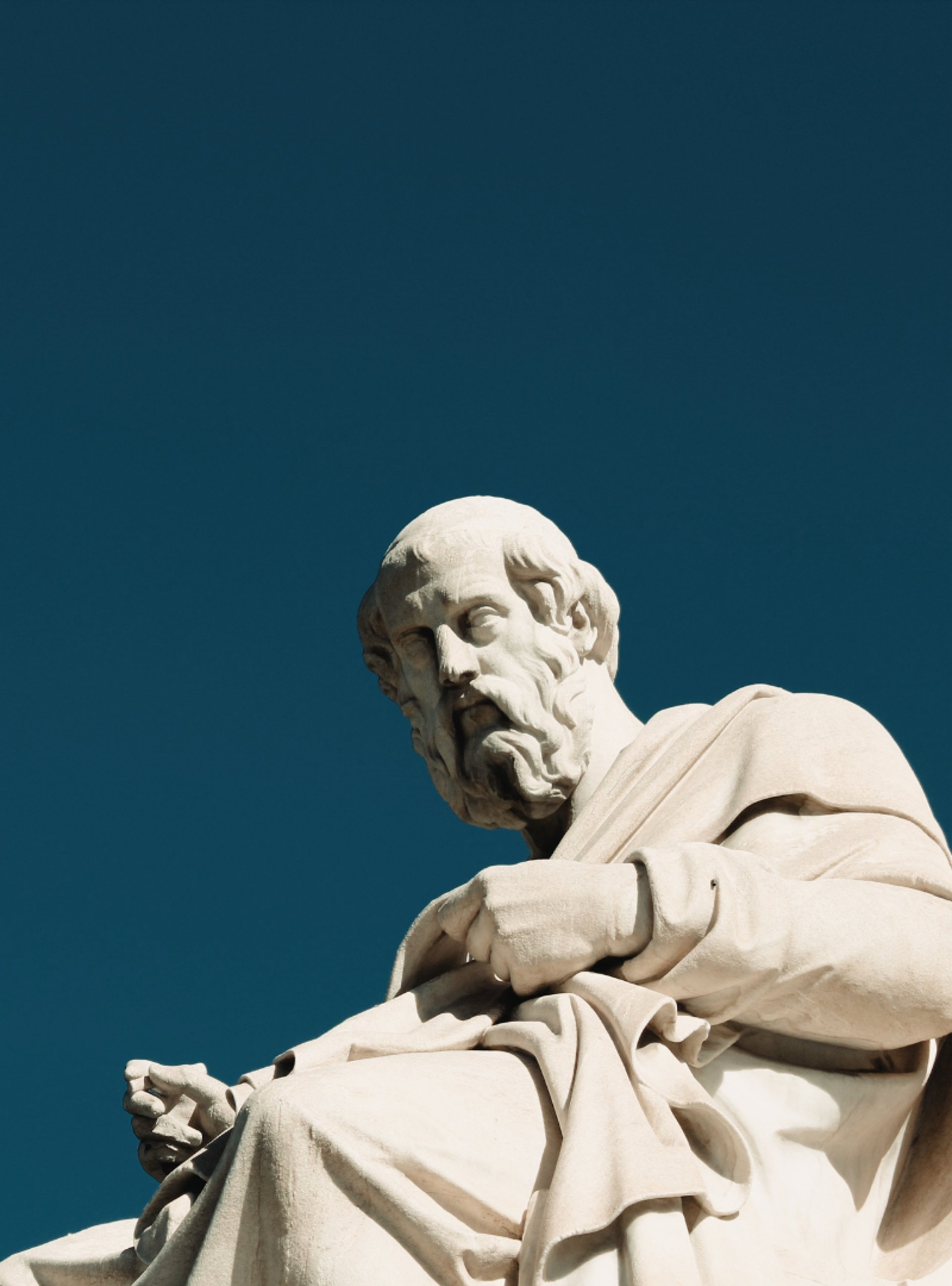 a statue of a man holding a sword