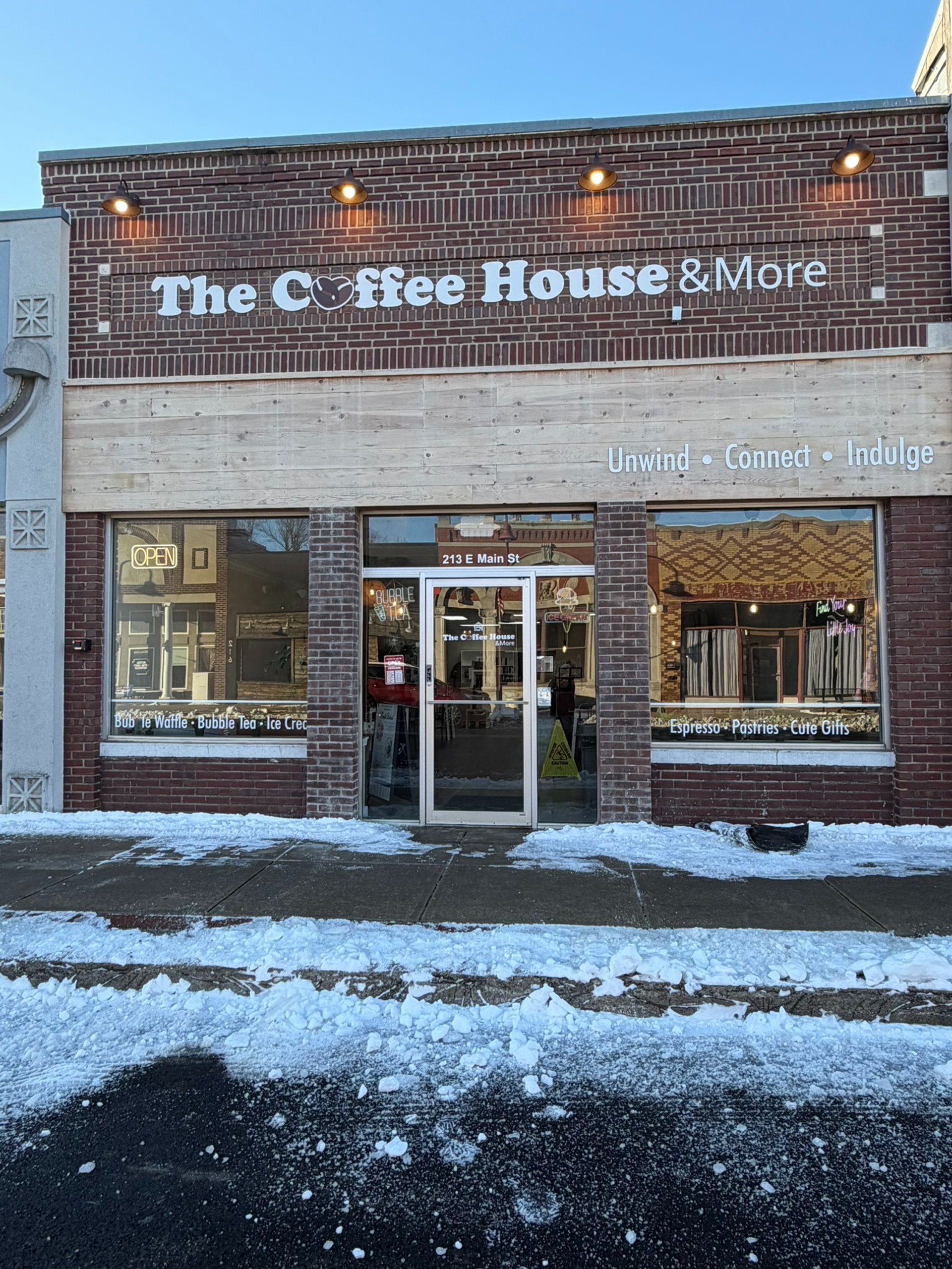 brown wooden book shelves with books