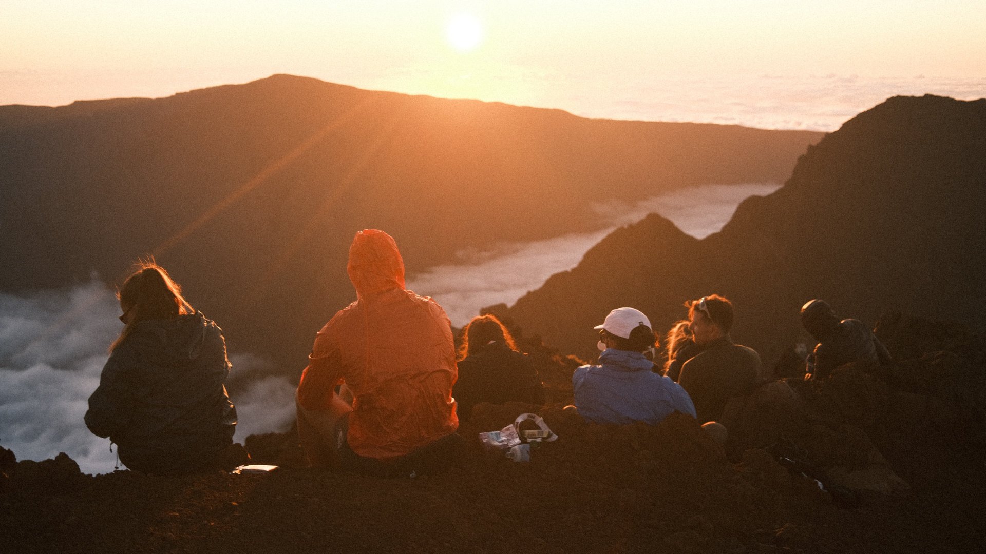 a view of a mountain range with trees in the foreground