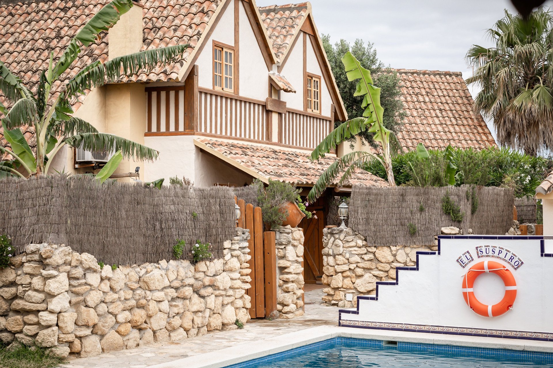 black and brown leather padded tub sofa
