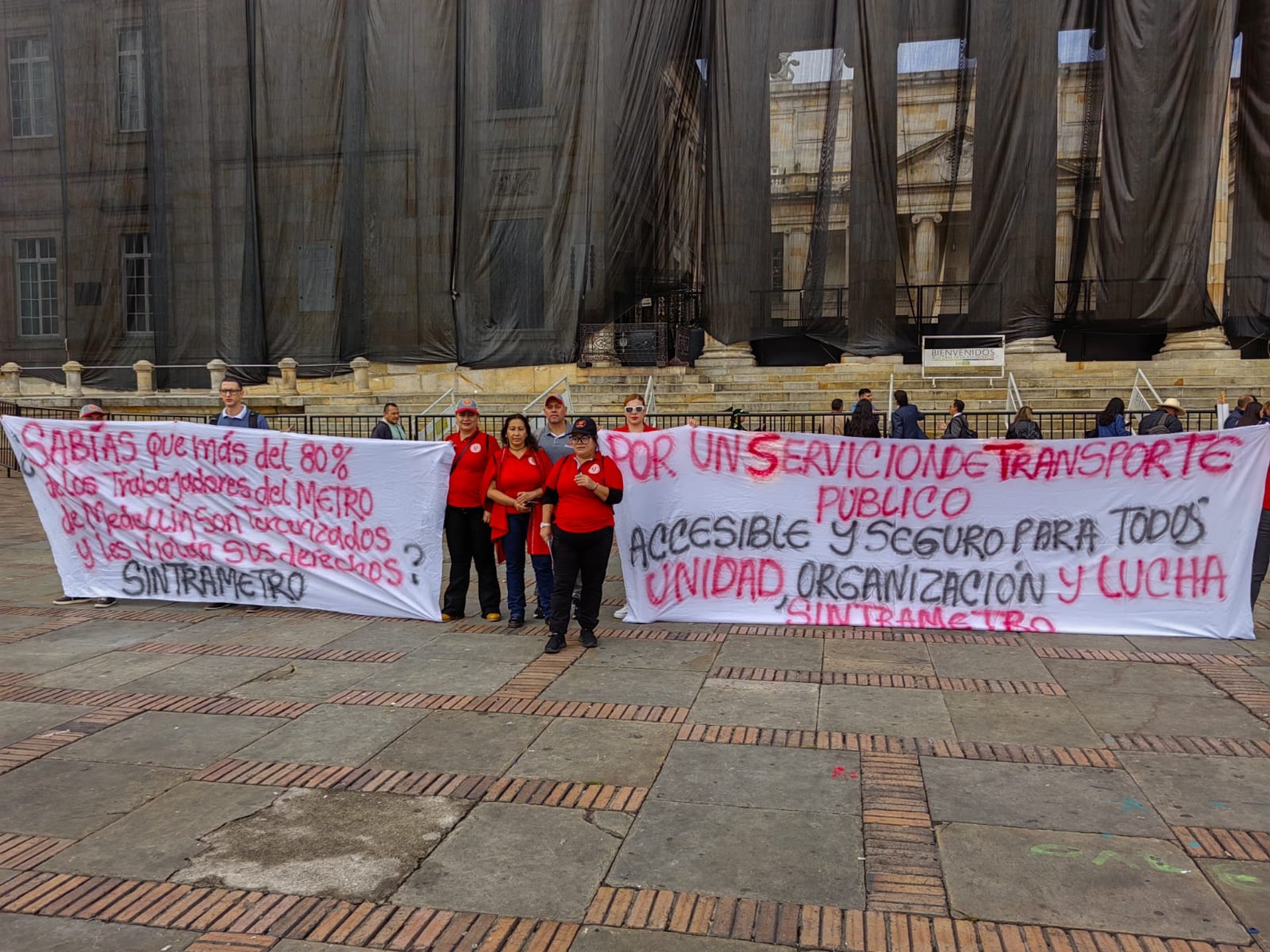 Workers are at an industrial clothing factory.