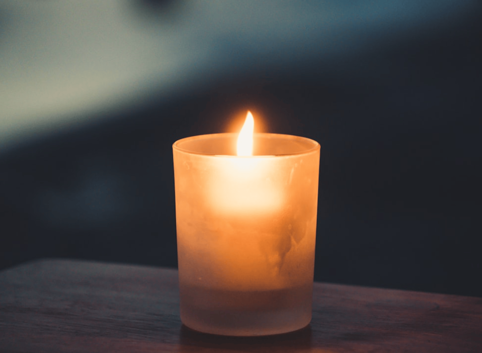 tea light on brown surface