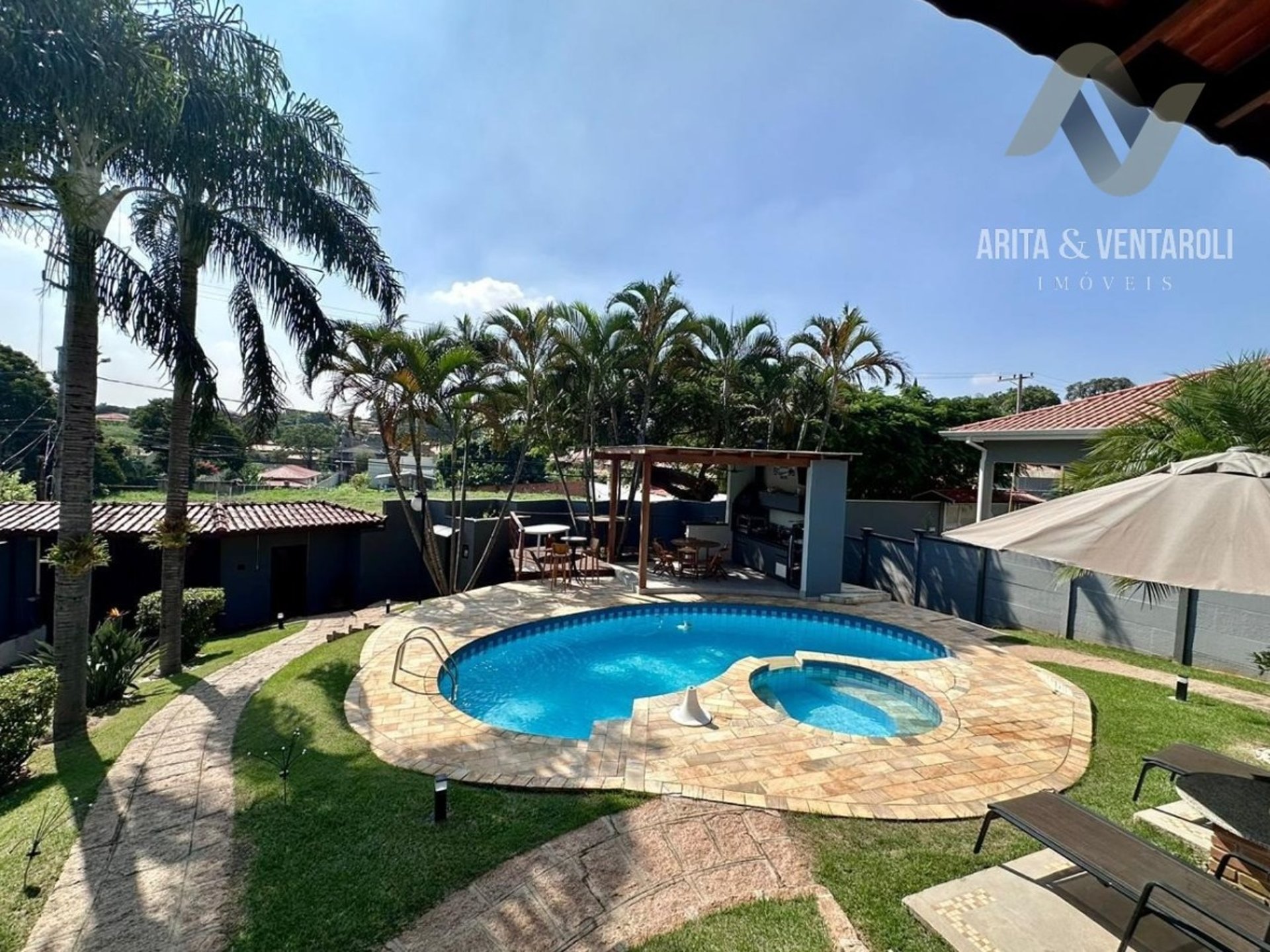 white and red wooden house miniature on brown table