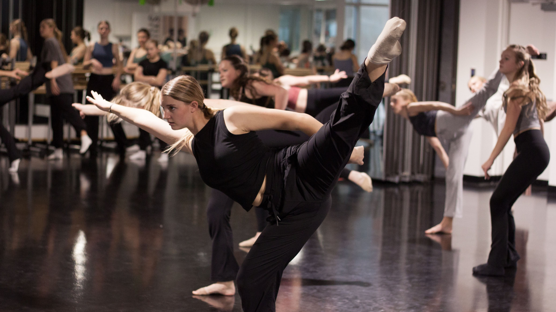 an abstract photo of a curved building with a blue sky in the background