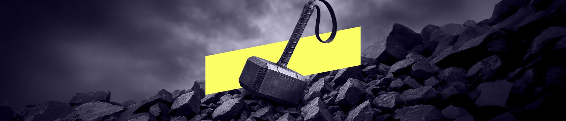 Wide banner image of hammer on rocks symbolising strength and resilience