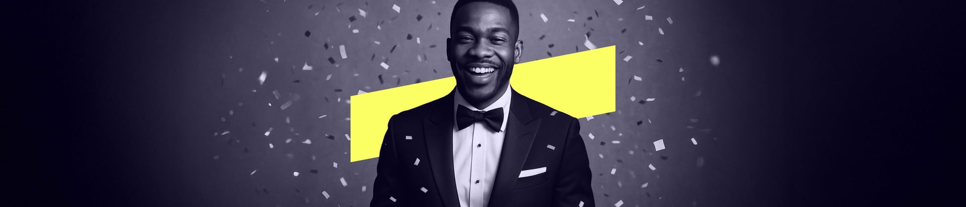A smiling man in a tuxedo stands surrounded by falling confetti, with a bold yellow background shape behind him.