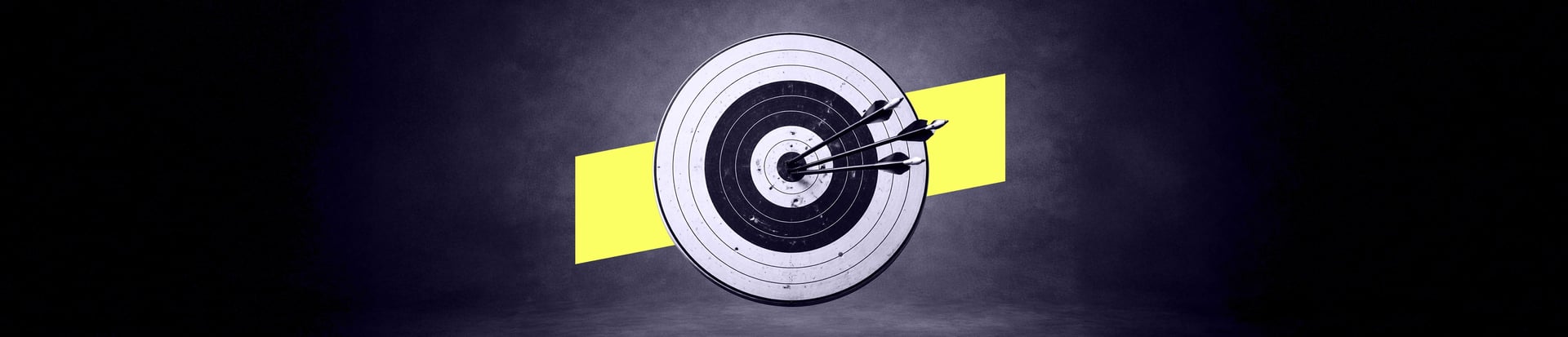 A circular target with several arrows clustered near the centre.