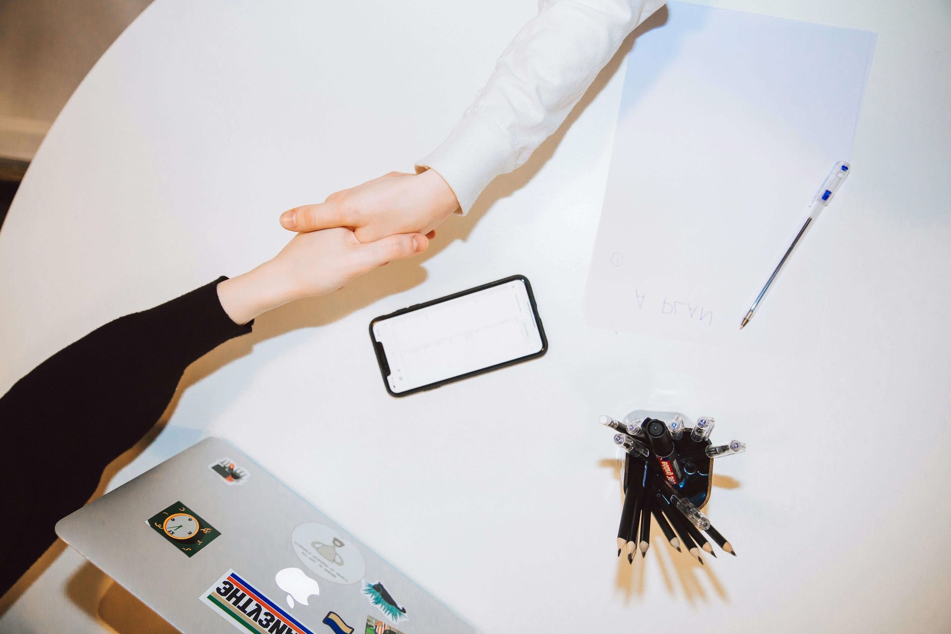 an abstract photo of a curved building with a blue sky in the background