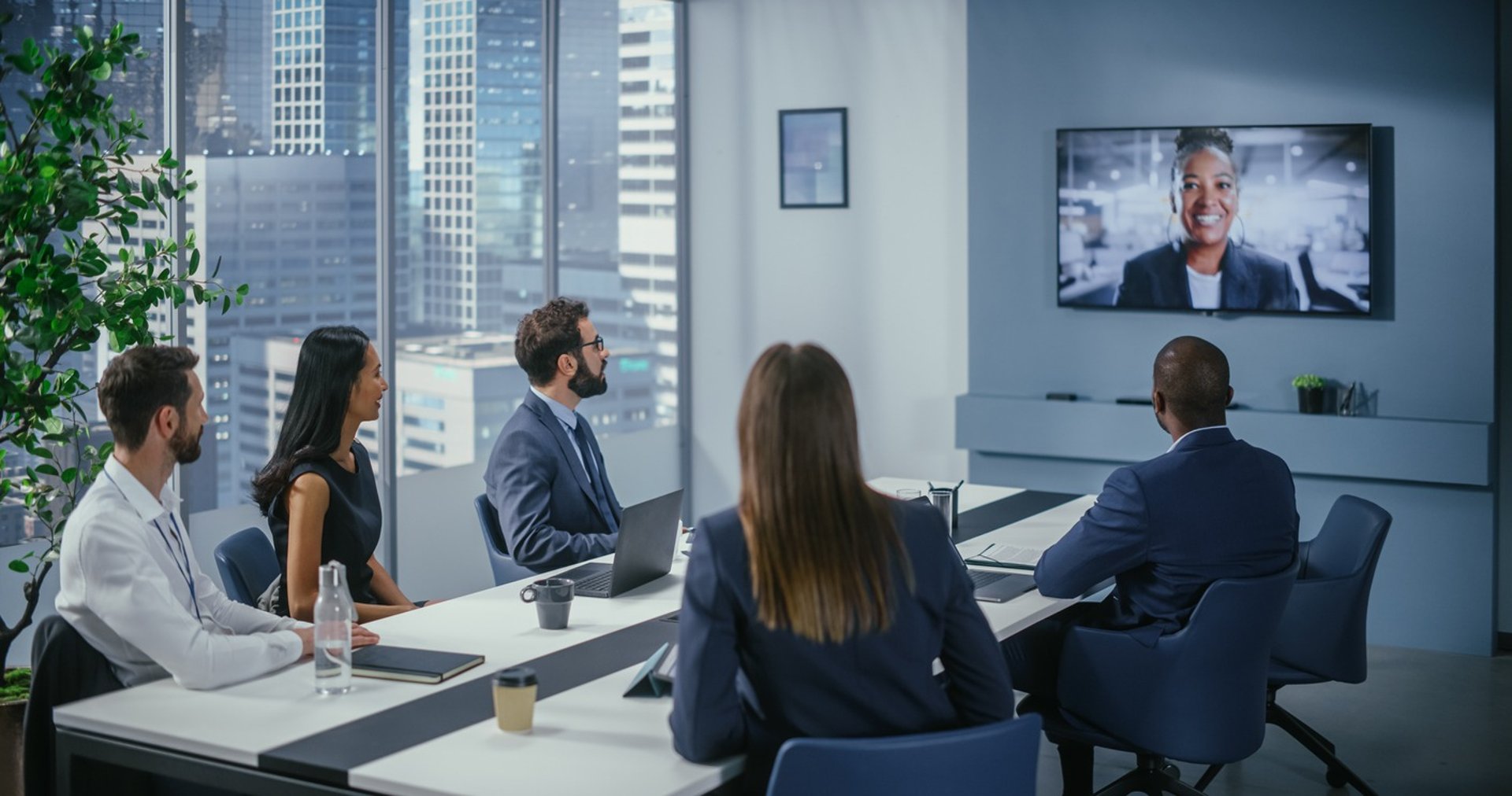 a group of people sitting around a conference table