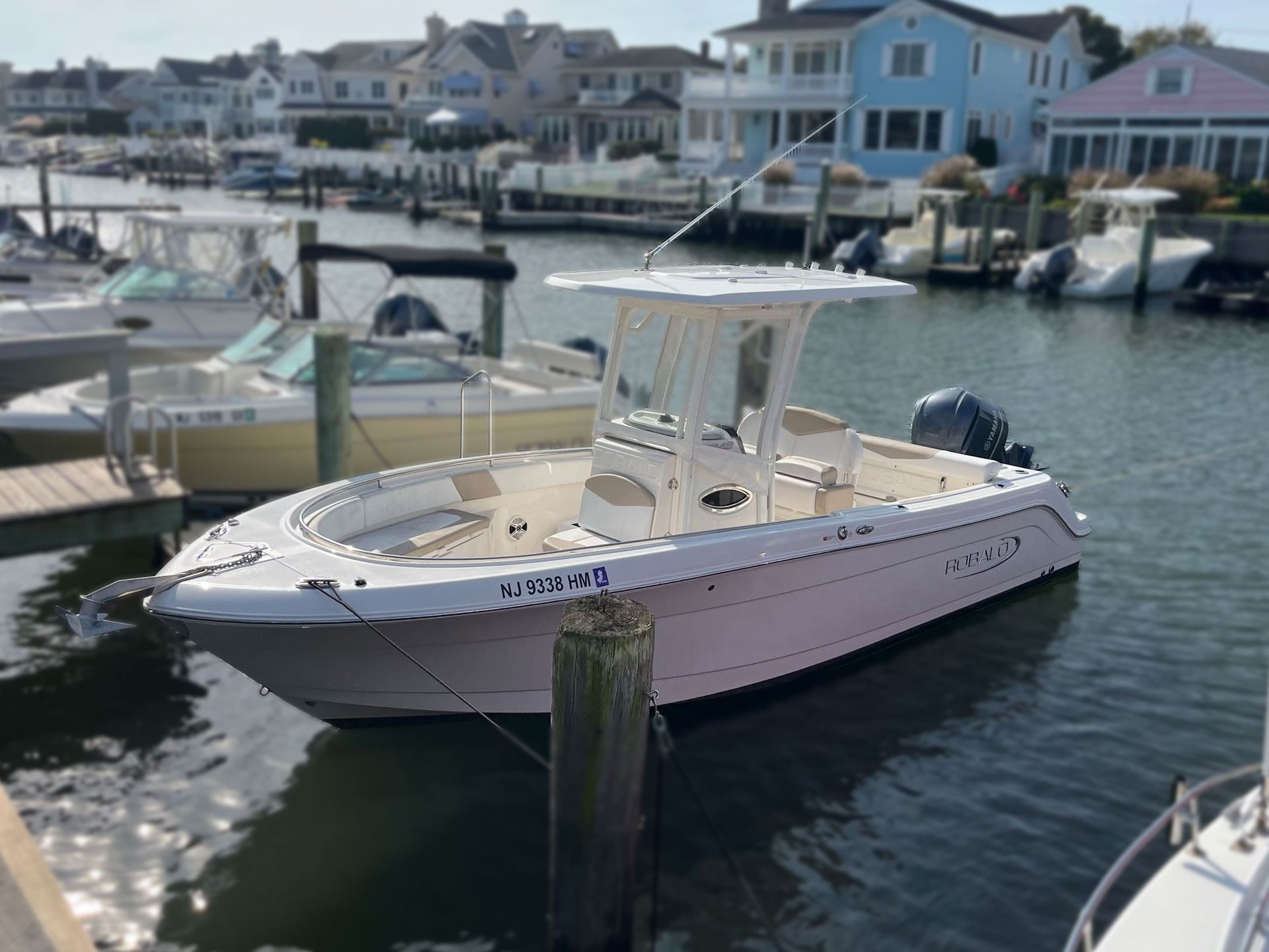 White Robalo boat floating in the bay