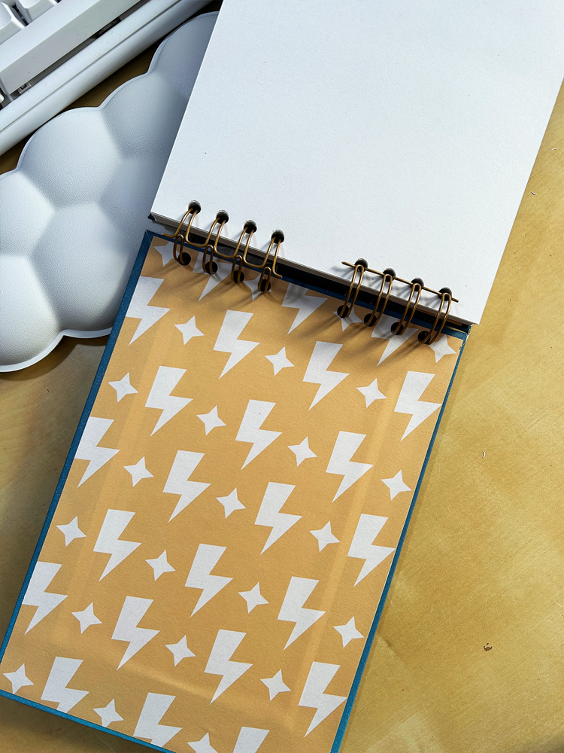 an abstract photo of a curved building with a blue sky in the background